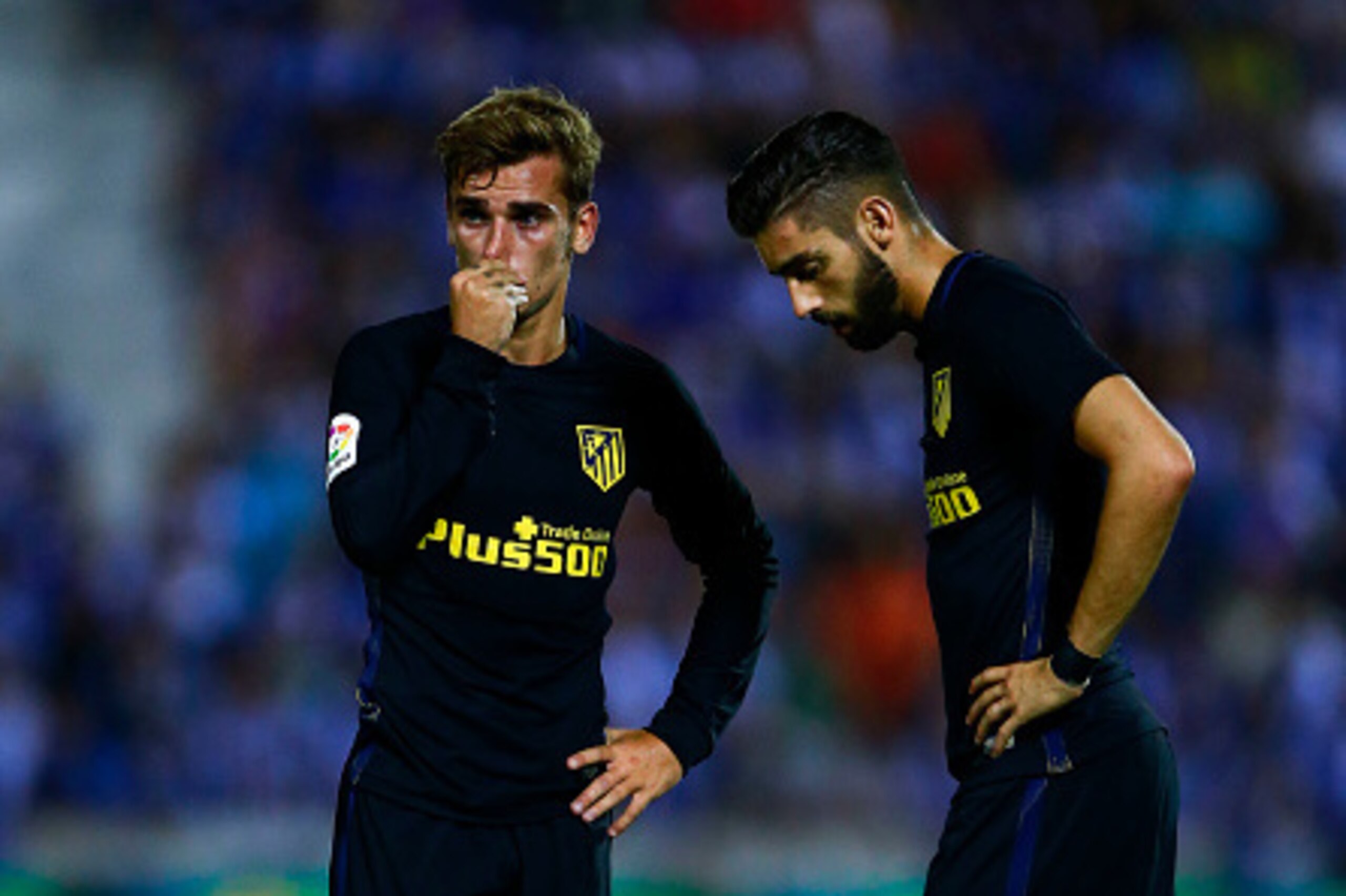 LEGANES, SPAIN - AUGUST 27: Antoine Griezmann (L) of Atletico de Madrid and his teammate Yannick Carrasco (R) react before striking the ball after a fault during the La Liga match between Club Deportivo Leganes and Club Atletico de Madrid at Estadio Munic LEGANES, SPAIN - AUGUST 27: Antoine Griezmann (L) of Atletico de Madrid and his teammate Yannick Carrasco (R) react before striking the ball after a fault during the La Liga match between Club Deportivo Leganes and Club Atletico de Madrid at Estadio Munic