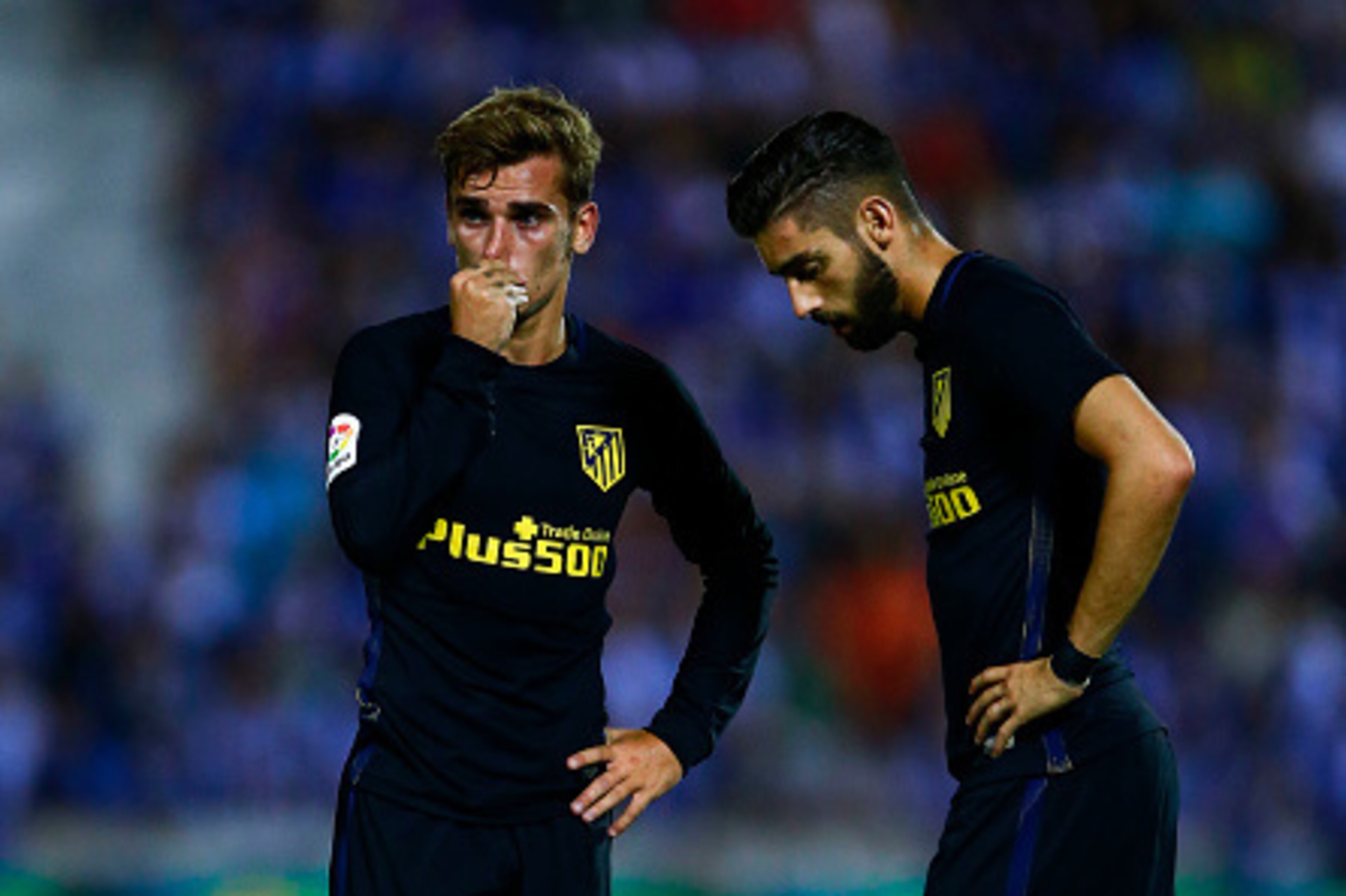 LEGANES, SPAIN - AUGUST 27: Antoine Griezmann (L) of Atletico de Madrid and his teammate Yannick Carrasco (R) react before striking the ball after a fault during the La Liga match between Club Deportivo Leganes and Club Atletico de Madrid at Estadio Munic