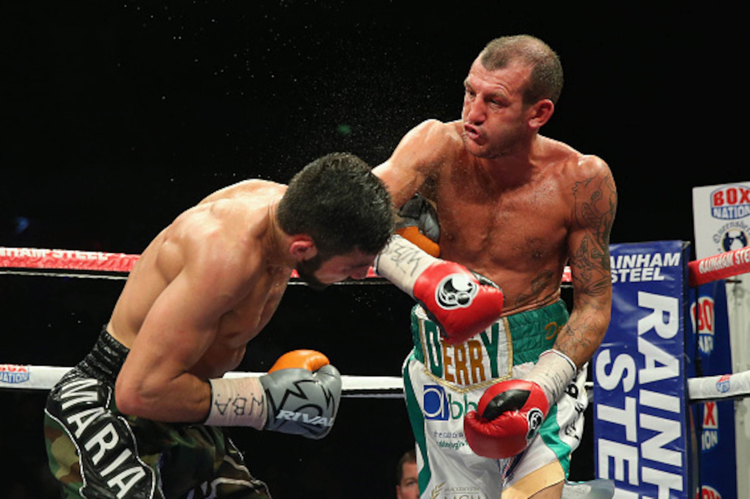 LIVERPOOL, ENGLAND - APRIL 18:  Derry Mathews throws a right punch at Tony Luis during The Vacant WBA Interim World Lightweight Championship fight between Derry Mathews and Tony Luis at the World Championship boxing event at Echo Arena on April 18, 2015 i