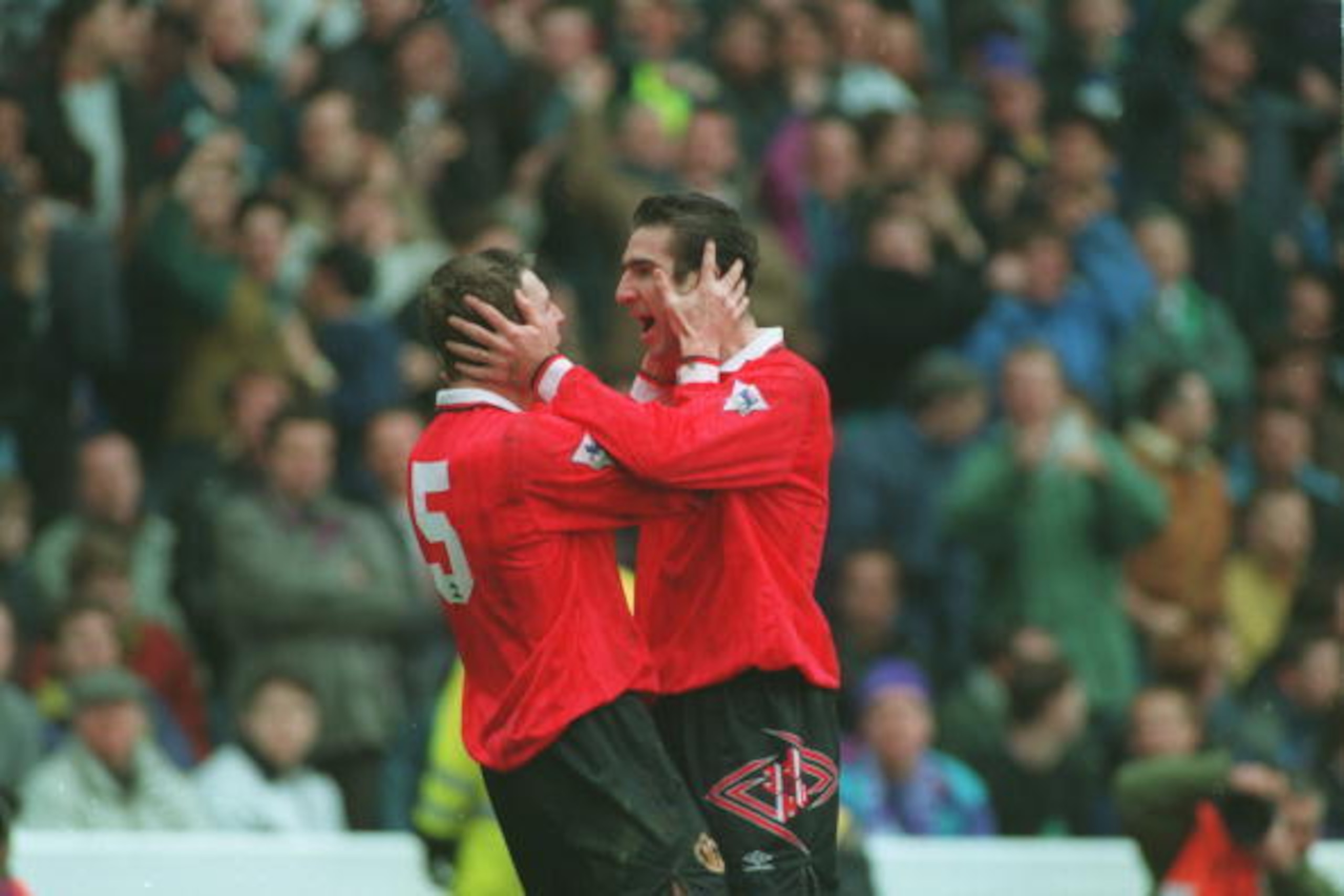 20 MAR 1993:  A PICTURE SHOWING ERIC CANTONA OF MANCHESTER UNITED SOCCER CLUB AS HE CELEBRATES SCORING A GOAL WITH TEAMMATE LEE SHARPE DURING THEIR MATCH AGAINST MANCHESTER CITY Mandatory Credit: Chris Cole/ALLSPORT