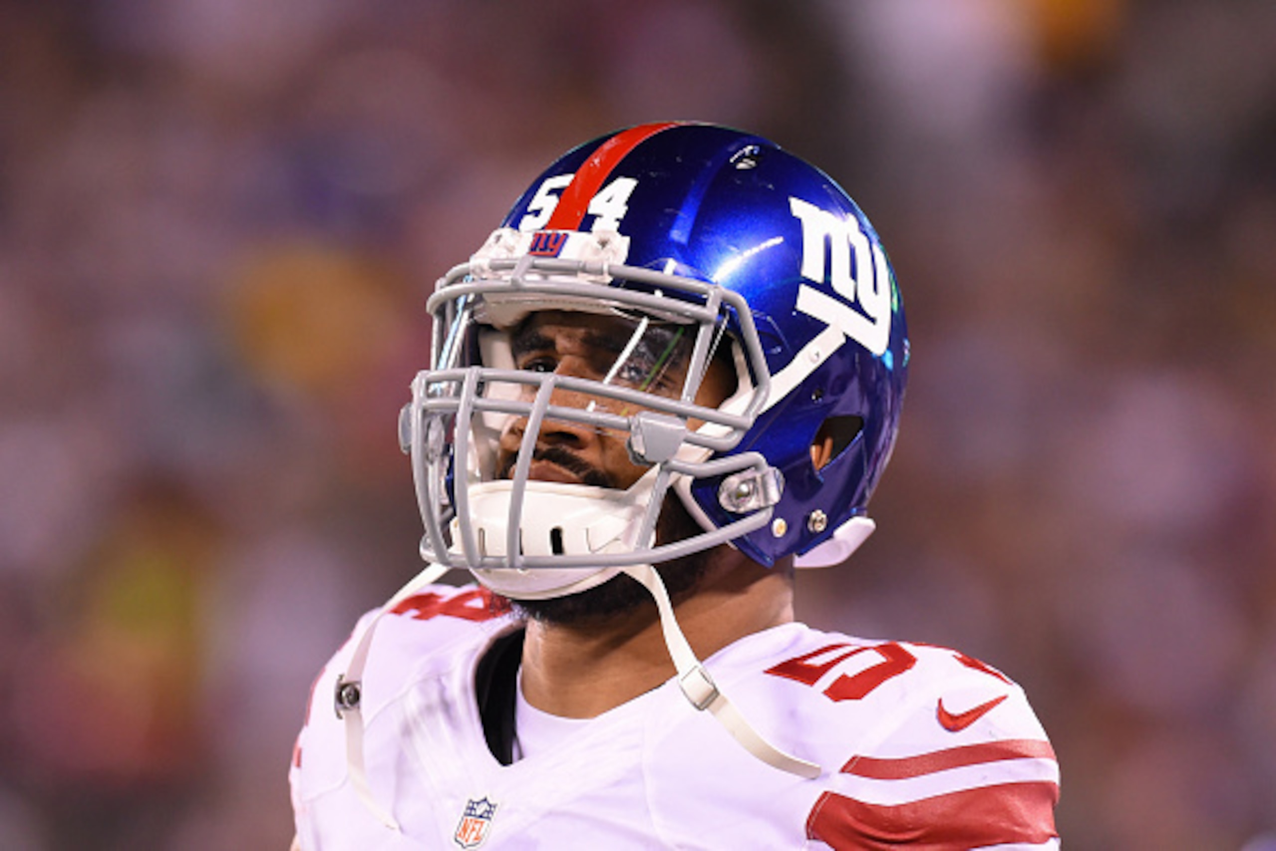 EAST RUTHERFORD, NJ - AUGUST 27:  Olivier Vernon #54 of the New York Giants looks on from the sidelines against the New York Jets during the second quarter at MetLife Stadium on August 27, 2016 in East Rutherford, New Jersey.  The Giants defeated the Jets