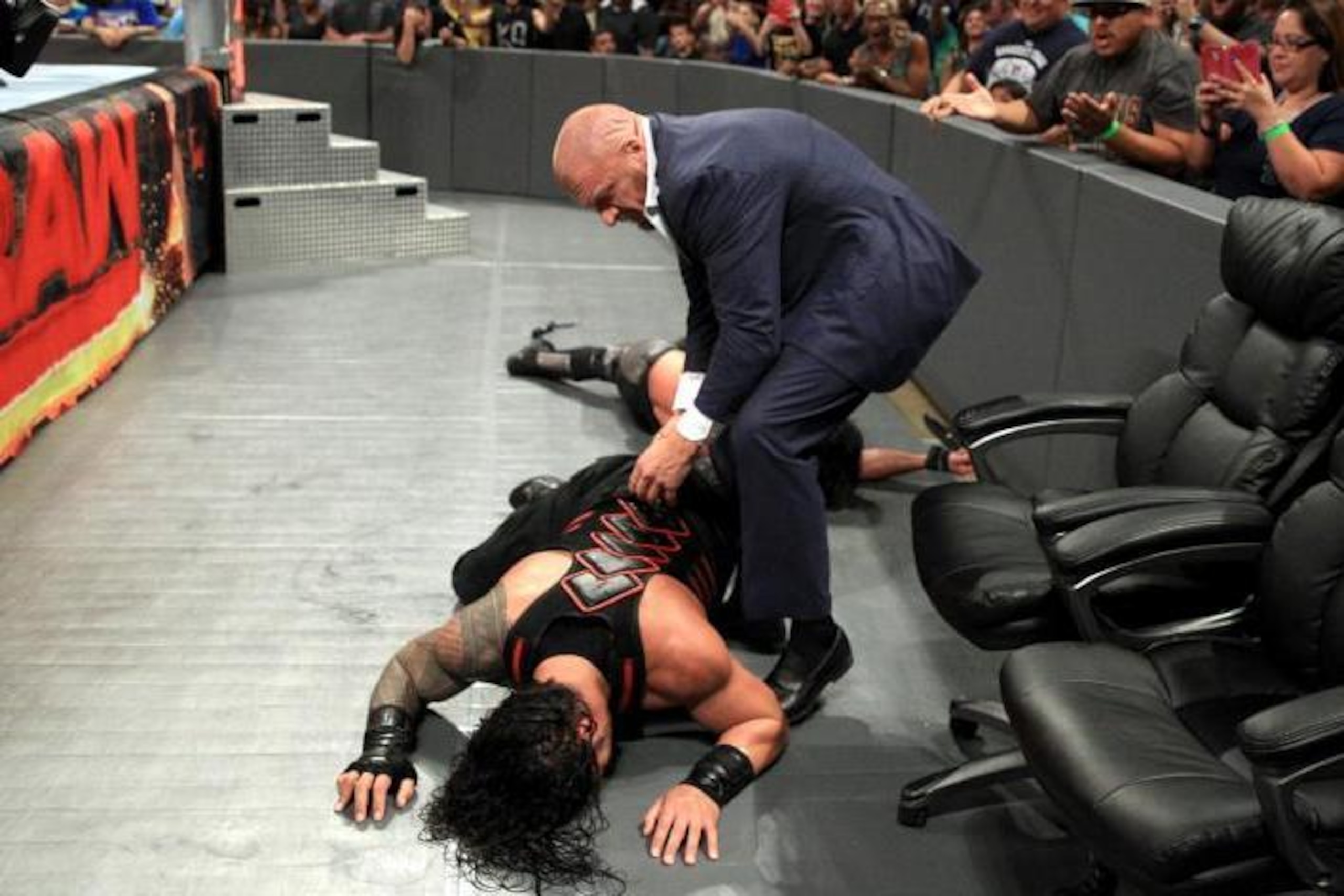 Triple H gets Roman up so Seth can get the pin.