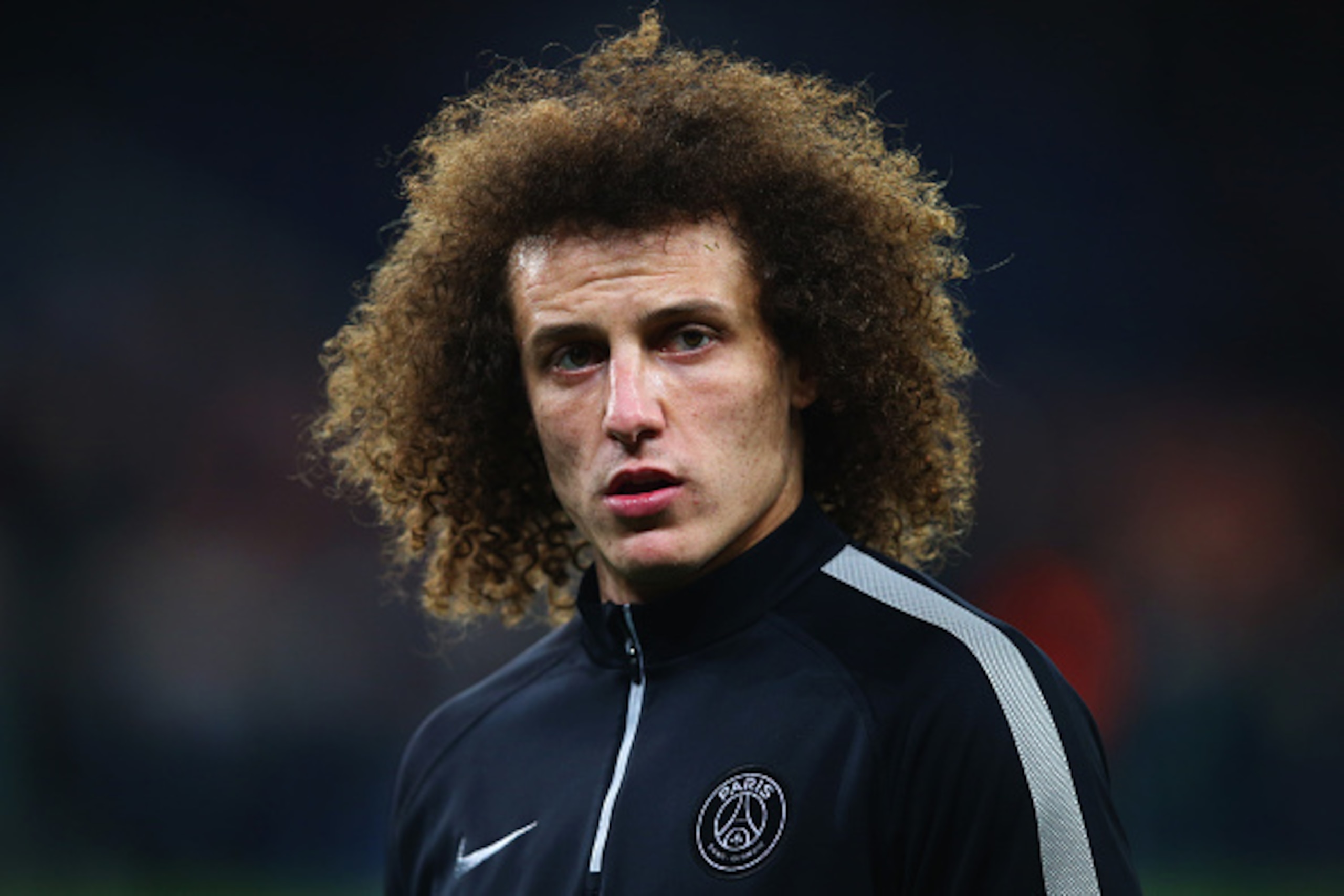 PARIS, FRANCE - FEBRUARY 17:  David Luiz of Paris Saint-Germain looks on prior to the UEFA Champions League Round of 16 match between Paris Saint-Germain and Chelsea at Parc des Princes on February 17, 2015 in Paris, France.  (Photo by Clive Rose/Getty Im