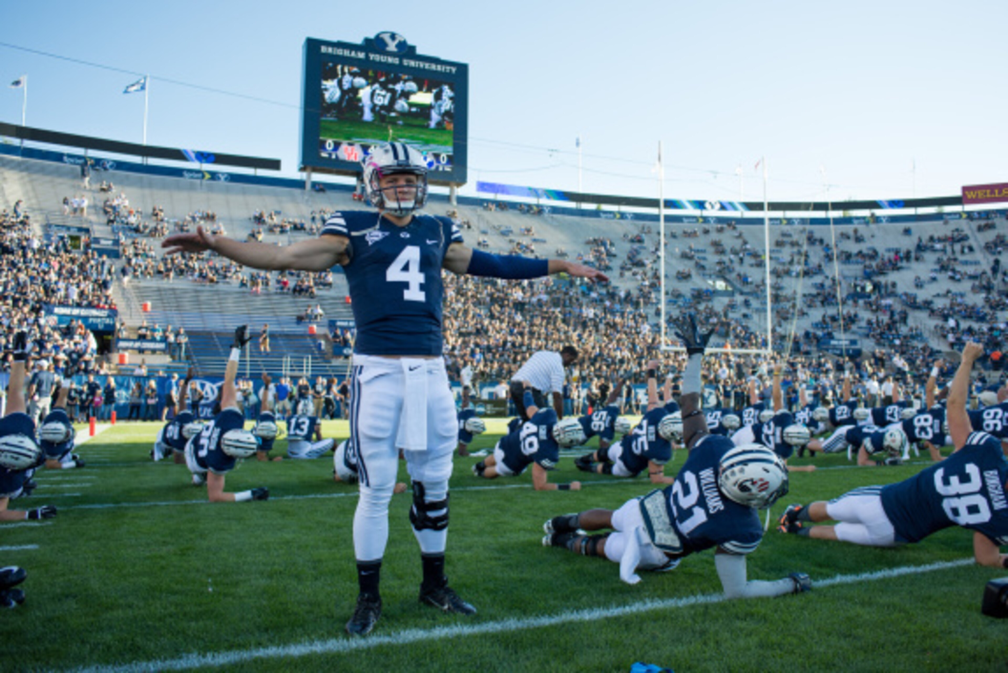 PROVO, UT - SEPTEMBER 11:   Quarterback Taysom Hill #4 of the BYU Cougars stretches before a game against the Houston Cougars on September 11, 2014 at LaVell Edwards Stadium in Provo, Utah. (Photo by Jay Drowns/Getty Images)