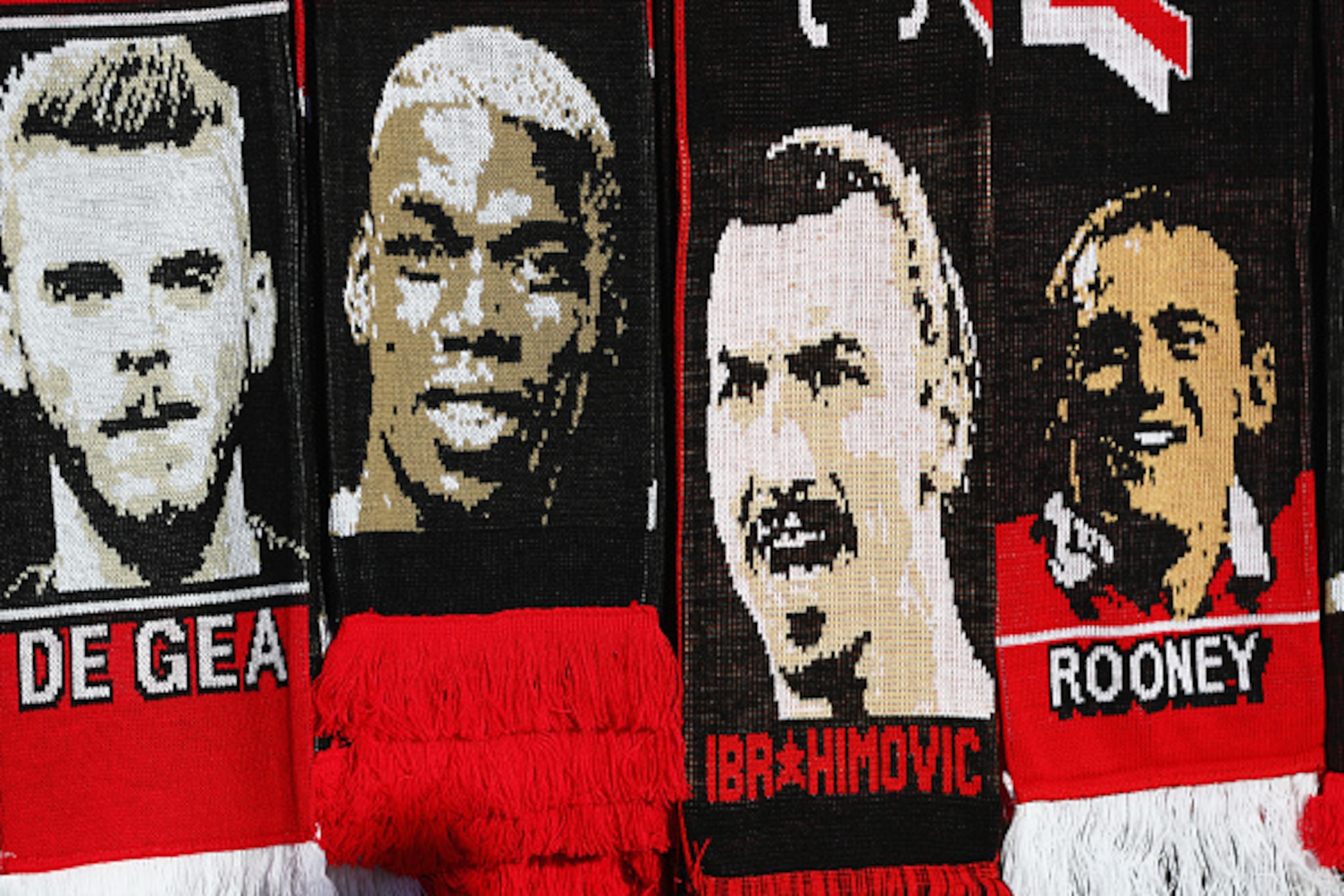 MANCHESTER, ENGLAND - AUGUST 19: Images of David De Gea, Paul Pogba, Zlatan Ibrahimovic and Wayne Rooney of Manchester United appear on scarves prior to the Premier League match between Manchester United and Southampton at Old Trafford on August 19, 2016 