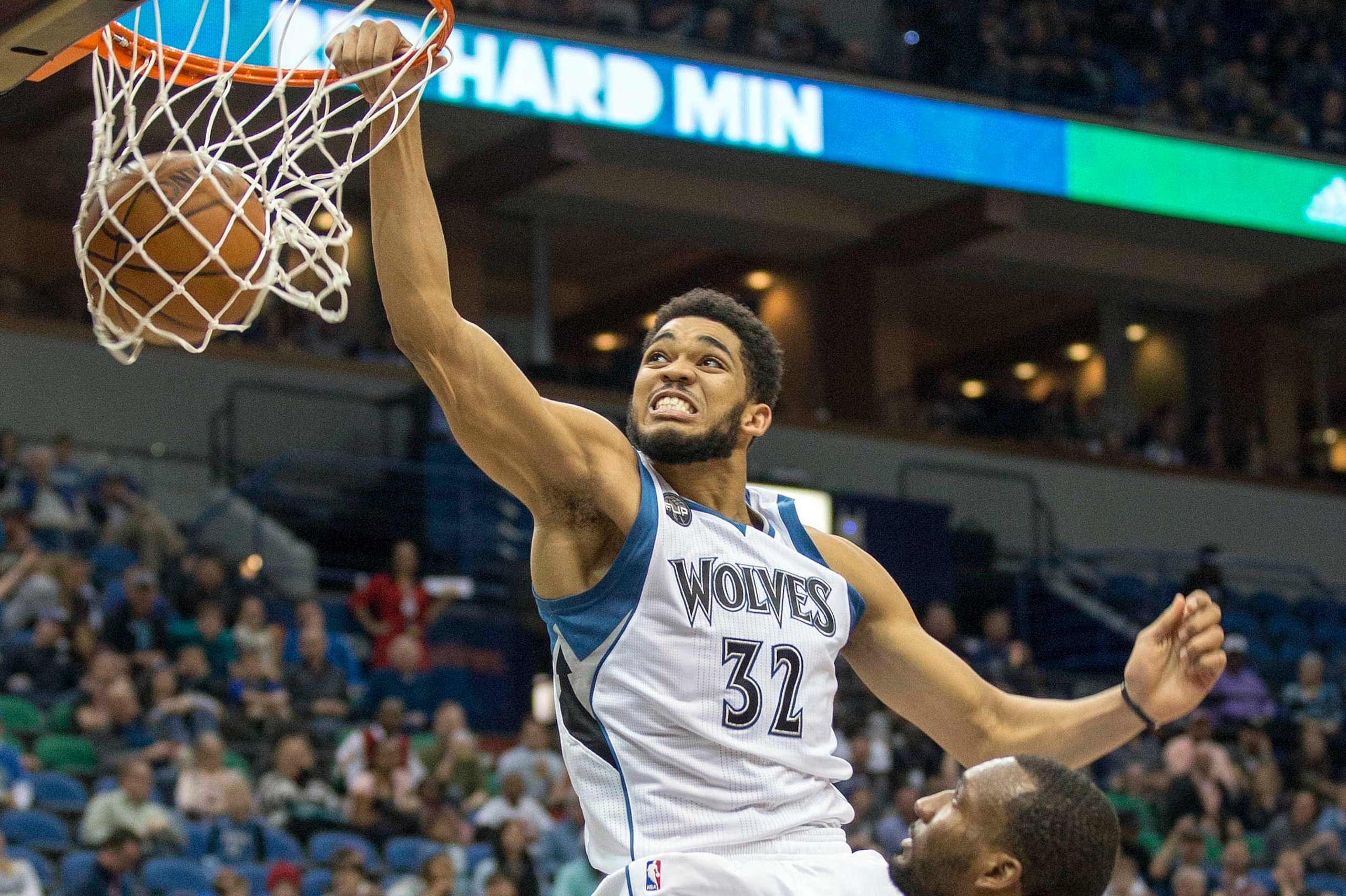 Apr 13, 2016; Minneapolis, MN, USA; Minnesota Timberwolves center Karl-Anthony Towns (32) dunks the ball in the second half against the New Orleans Pelicans at Target Center. The Timberwolves won 144-109. Mandatory Credit: Jesse Johnson-USA TODAY Sports