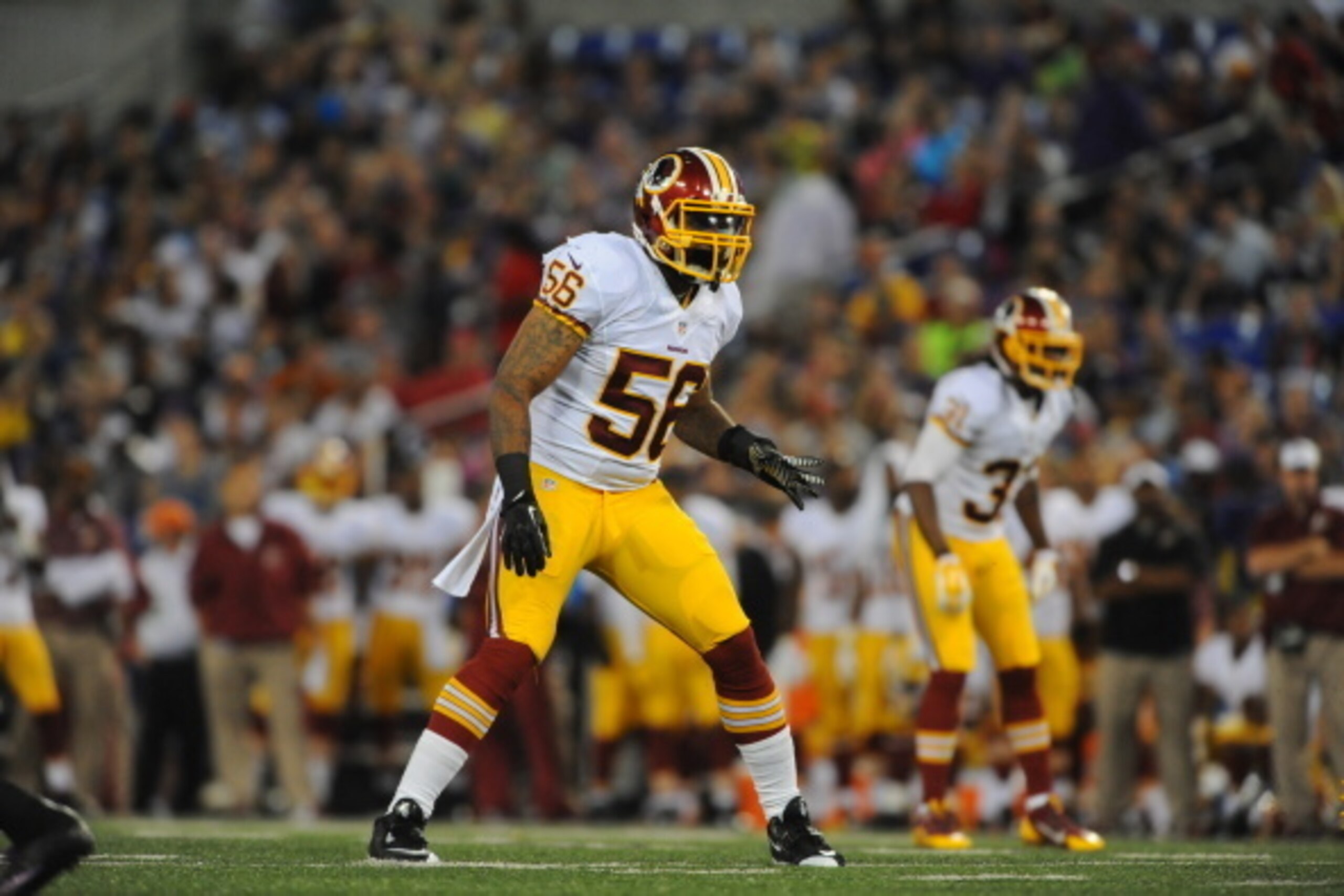 BALTIMORE, MD - AUGUST 23:  Inside linebacker Perry Riley #56 of the Washington Redskins defends against the Baltimore Ravens during a preseason game at M&T Bank Stadium on August 23, 2014 in Baltimore, Maryland.  (Photo by Larry French/Getty Images)