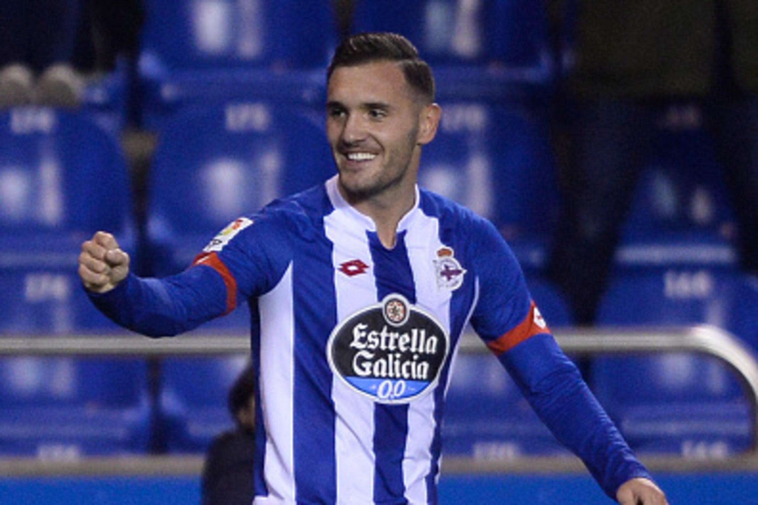 Deportivo La Coruna's midfielder Lucas Perez celebrates after scoring a goal during the Spanish league football match RC Deportivo de la Coruna vs Sevilla FC at the Municipal de Riazor stadium in La Coruna on December 5, 2015.    / AFP / MIGUEL RIOPA     