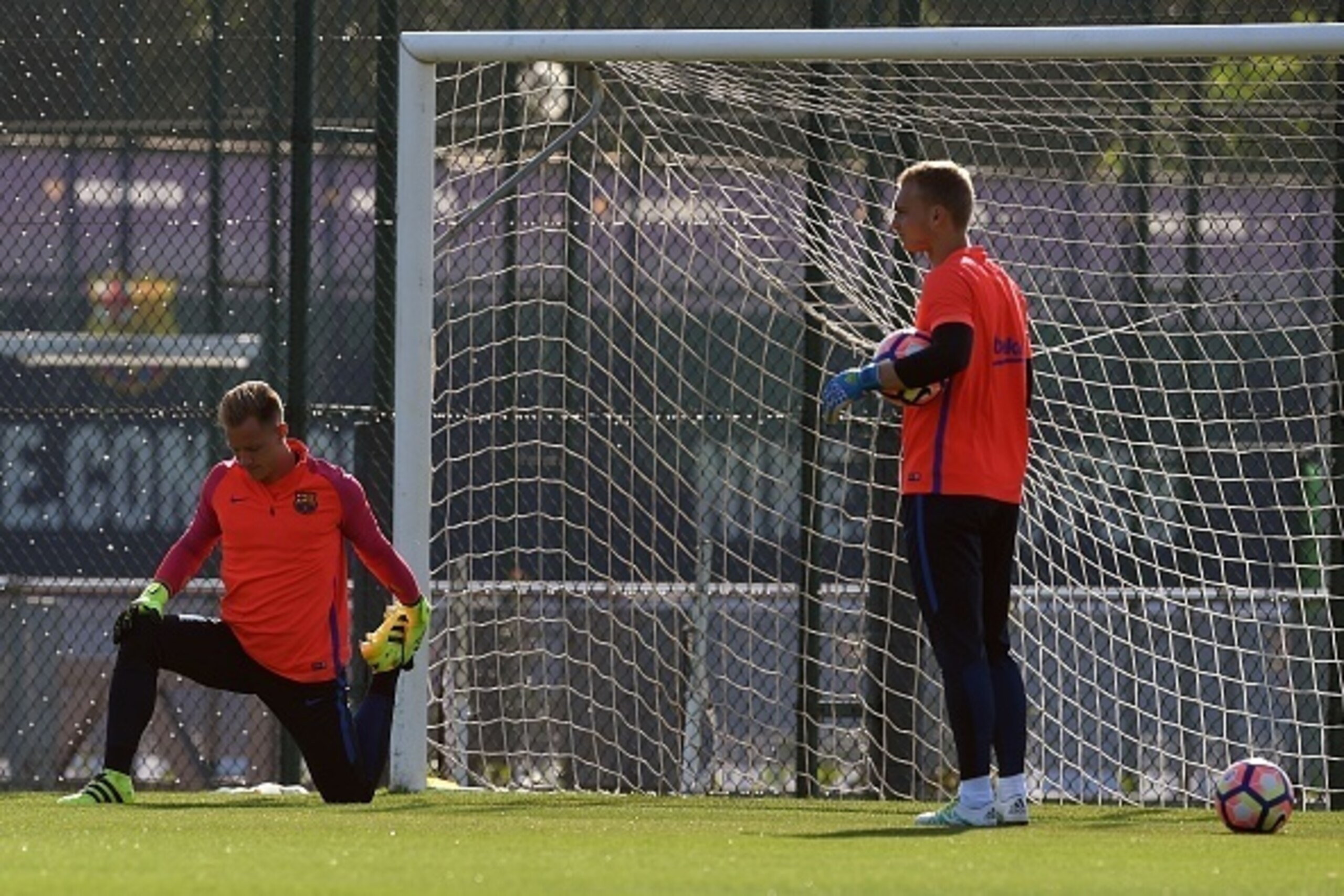 The new Barcelona's Dutch goalkeeper Jasper Cillessen (R) looks at Barcelona's German goalkeeper Marc-Andre Ter Stegen (L) during a training session at the Sports Center FC Barcelona Joan Gamper in Sant Joan Despi, near Barcelona on August 27, 2016, on th The new Barcelona's Dutch goalkeeper Jasper Cillessen (R) looks at Barcelona's German goalkeeper Marc-Andre Ter Stegen (L) during a training session at the Sports Center FC Barcelona Joan Gamper in Sant Joan Despi, near Barcelona on August 27, 2016, on th