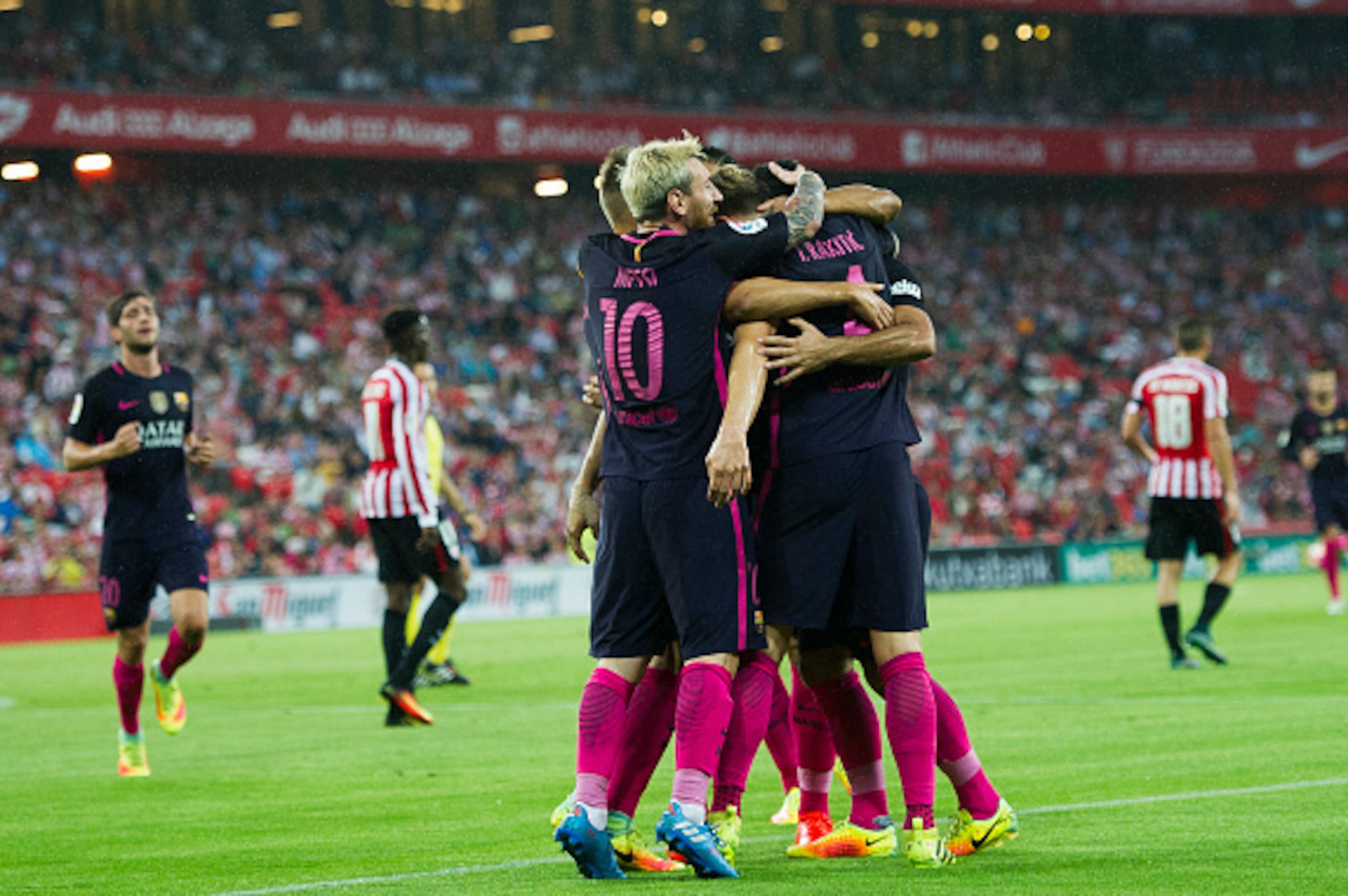 BILBAO, SPAIN - AUGUST 28:  Ivan Rakitic (R) of FC Barcelona celebrates with his teammate Lionel Messi, Denis Suarez and  Luis Suarez of FC Barcelona after scoring the opening goal during the La Liga match between Athletic Club Bilbao and FC Barcelona at 