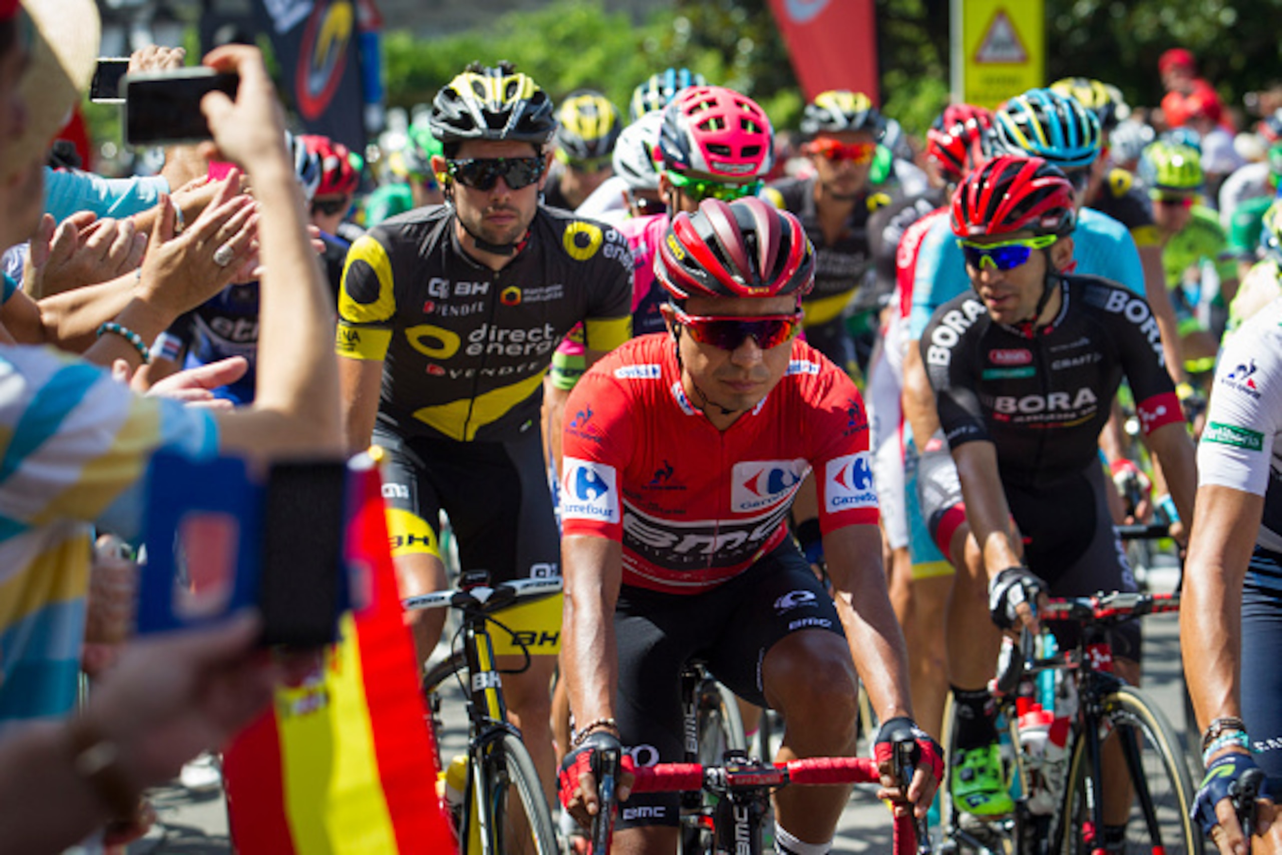 BMC's Colombian cyclist Darwin Atapuma (C) rides as he takes the start of the 6th stage of the 71st edition of 'La Vuelta' Tour of Spain, a 163,2 km route between Monforte de Lemos to Luintra on August 25, 2016. / AFP / JAIME REINA        (Photo credit sh