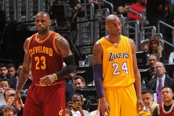 LOS ANGELES, CA - MARCH 10:  LeBron James #23 of the Cleveland Cavaliers and Kobe Bryant #24 of the Los Angeles Lakers stand on the court during the game at STAPLES Center on March 10, 2016 in Los Angeles, California. NOTE TO USER: User expressly acknowle