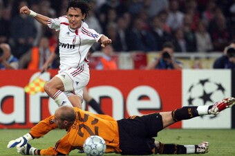 Athens, GREECE: AC Milan's forward Filippo Inzaghi scores a second goal against Liverpool's Spanish goalkeeper Pepe Reina during the Champions League football match, at the Olympic Stadium, in Athens, 23 May 2007. Milan won 2-1. he British embassy in Athe
