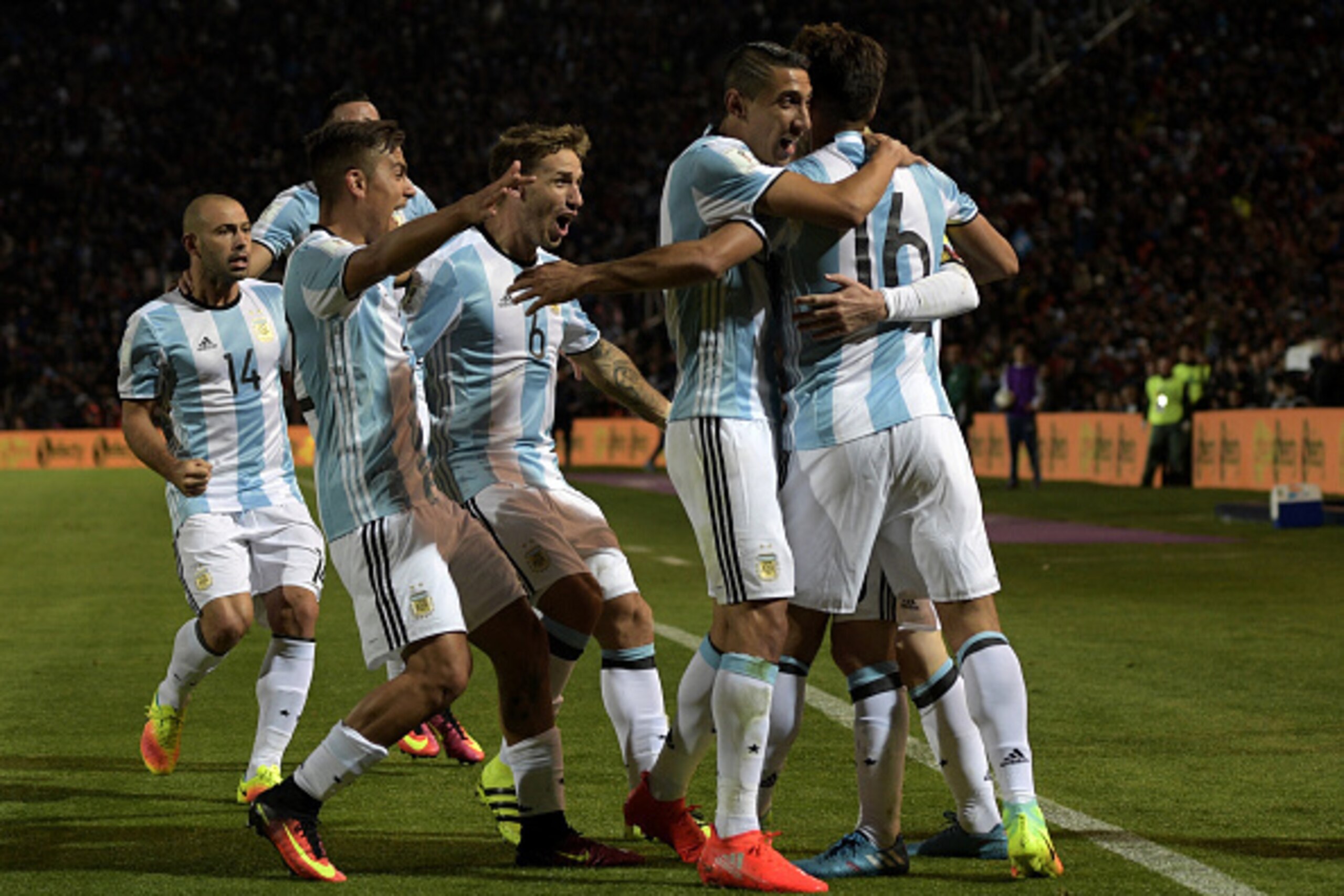 Argentina's Lionel Messi celebrates with teammates after scoring against Uruguay during the FIFA World Cup 2018 qualifier football match between Argentina and Uruguay in Mendoza, Argentina, on September 1, 2016. / AFP / JUAN MABROMATA        (Photo credit