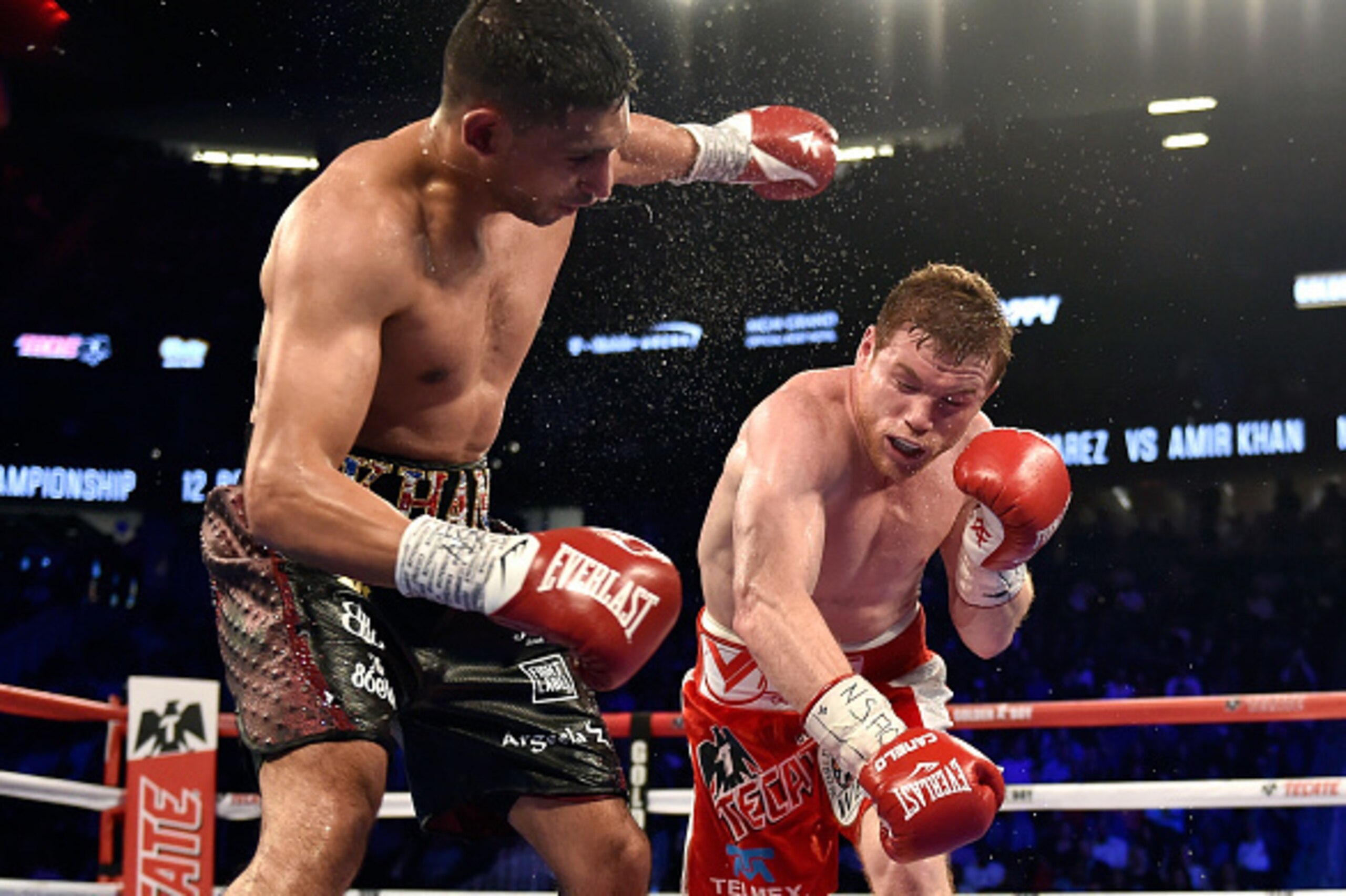 LAS VEGAS, NEVADA - MAY 07: Canelo Alvarez (R) delivers the knockout punch to Amir Khan during the sixth round of their WBC middleweight title fight at T-Mobile Arena on May 7, 2016 in Las Vegas, Nevada. (Photo by David Becker/Getty Images) LAS VEGAS, NEVADA - MAY 07: Canelo Alvarez (R) delivers the knockout punch to Amir Khan during the sixth round of their WBC middleweight title fight at T-Mobile Arena on May 7, 2016 in Las Vegas, Nevada. (Photo by David Becker/Getty Images)
