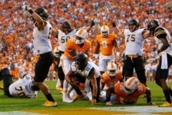 Sep 1, 2016; Knoxville, TN, USA; Appalachian State Mountaineers quarterback Taylor Lamb (11) attempts to get to his feet after scoring a touchdown against the Tennessee Volunteers during the first quarter at Neyland Stadium. Mandatory Credit: Randy Sartin