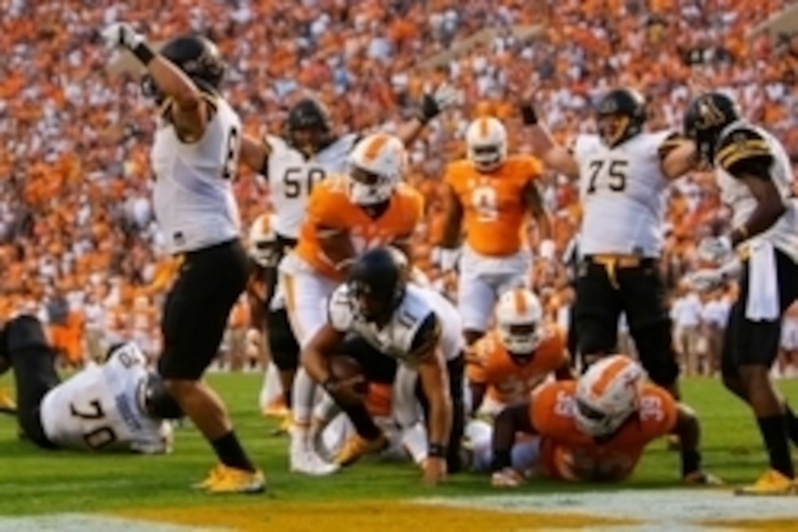 Sep 1, 2016; Knoxville, TN, USA; Appalachian State Mountaineers quarterback Taylor Lamb (11) attempts to get to his feet after scoring a touchdown against the Tennessee Volunteers during the first quarter at Neyland Stadium. Mandatory Credit: Randy Sartin