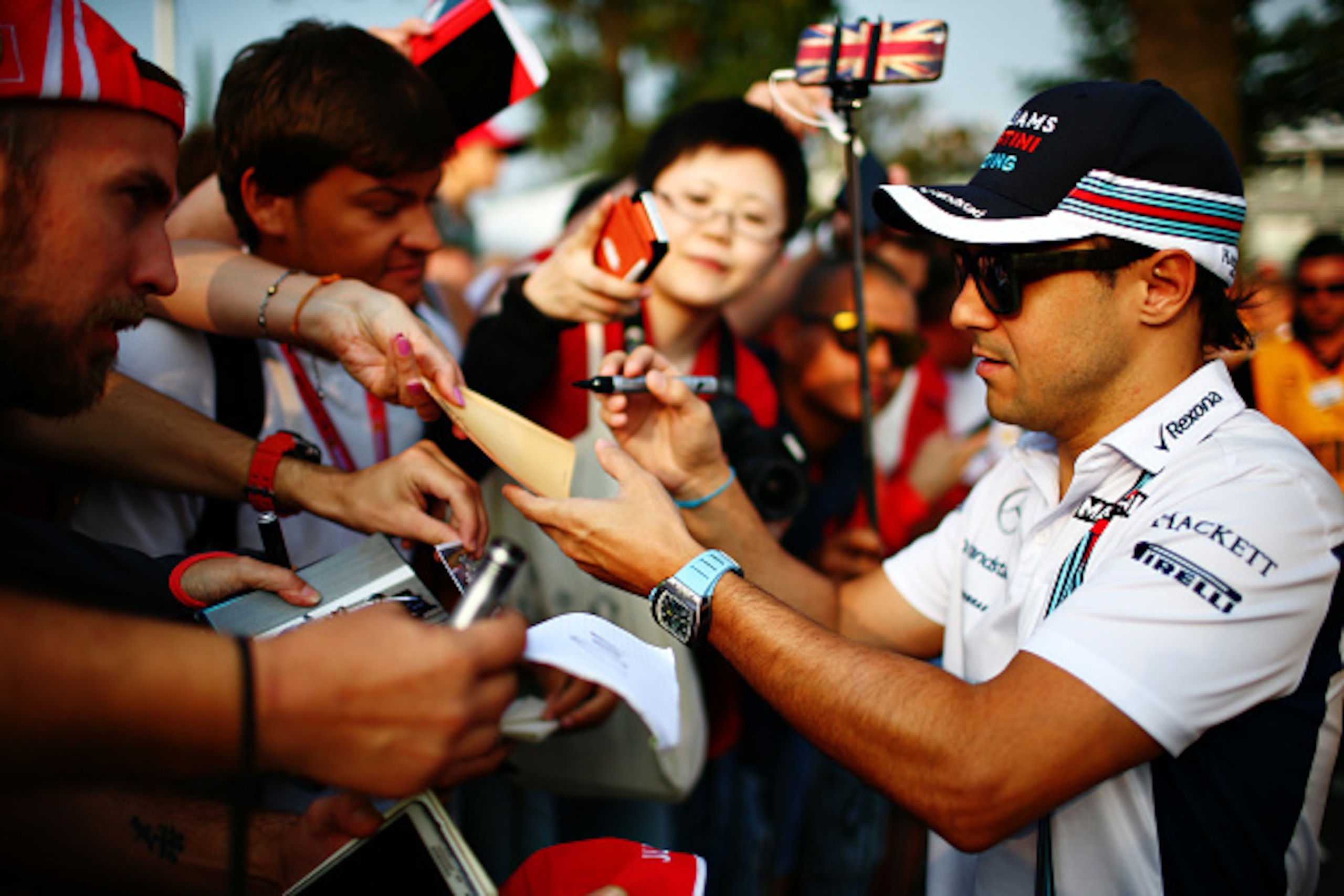 MONZA, ITALY - SEPTEMBER 02:  Felipe Massa of Brazil and Williams arrives at the circuit and signs autographs for fans during practice for the Formula One Grand Prix of Italy at Autodromo di Monza on September 2, 2016 in Monza, Italy.  (Photo by Dan Istit