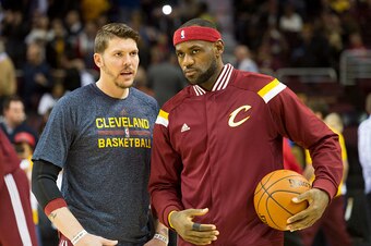 CLEVELAND, OH - NOVEMBER 19: Mike Miller #18 of the Cleveland Cavaliers and LeBron James #23 talk on the sidelines during the first half against the San Antonio Spurs at Quicken Loans Arena on November 19, 2014 in Cleveland, Ohio. User expressly acknowled