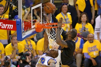 OAKLAND, CA - JUNE 19:  LeBron James #23 of the Cleveland Cavaliers blocks a shot against Andre Iguodala #9 of the Golden State Warriors during Game Seven of the 2016 NBA Finals on June 19, 2016 at ORALCE Arena in Oakland, California. NOTE TO USER: User e