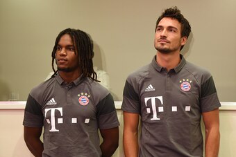Bayern Munich's Portuguese midfielder Renato Sanches (L) and defender Mats Hummels (R) wait prior a press conference ahead season presentation of the German first division Bundesliga club FC Bayern Munich in the stadium in Munich, southern Germany, on Aug