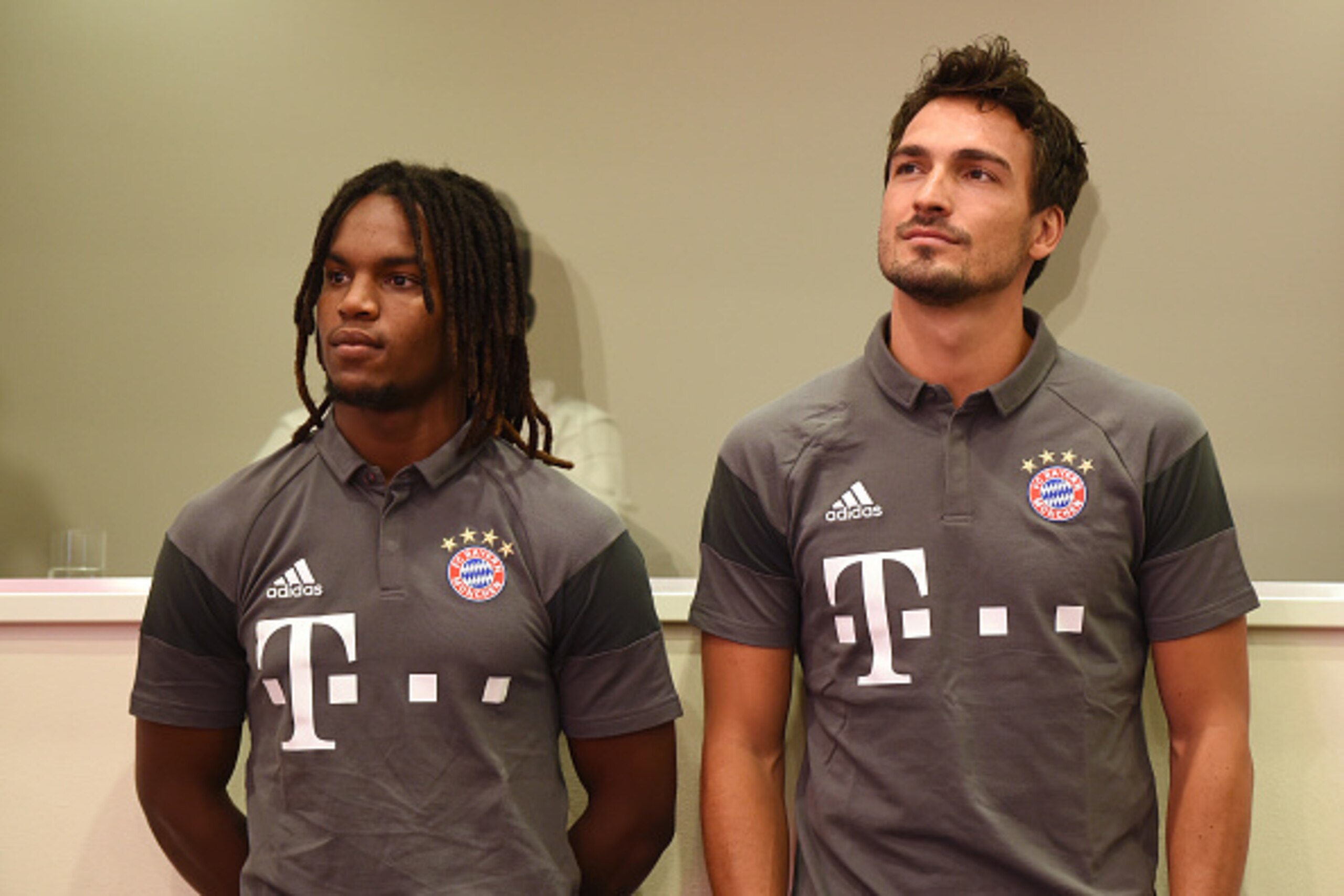 Bayern Munich's Portuguese midfielder Renato Sanches (L) and defender Mats Hummels (R) wait prior a press conference ahead season presentation of the German first division Bundesliga club FC Bayern Munich in the stadium in Munich, southern Germany, on Aug
