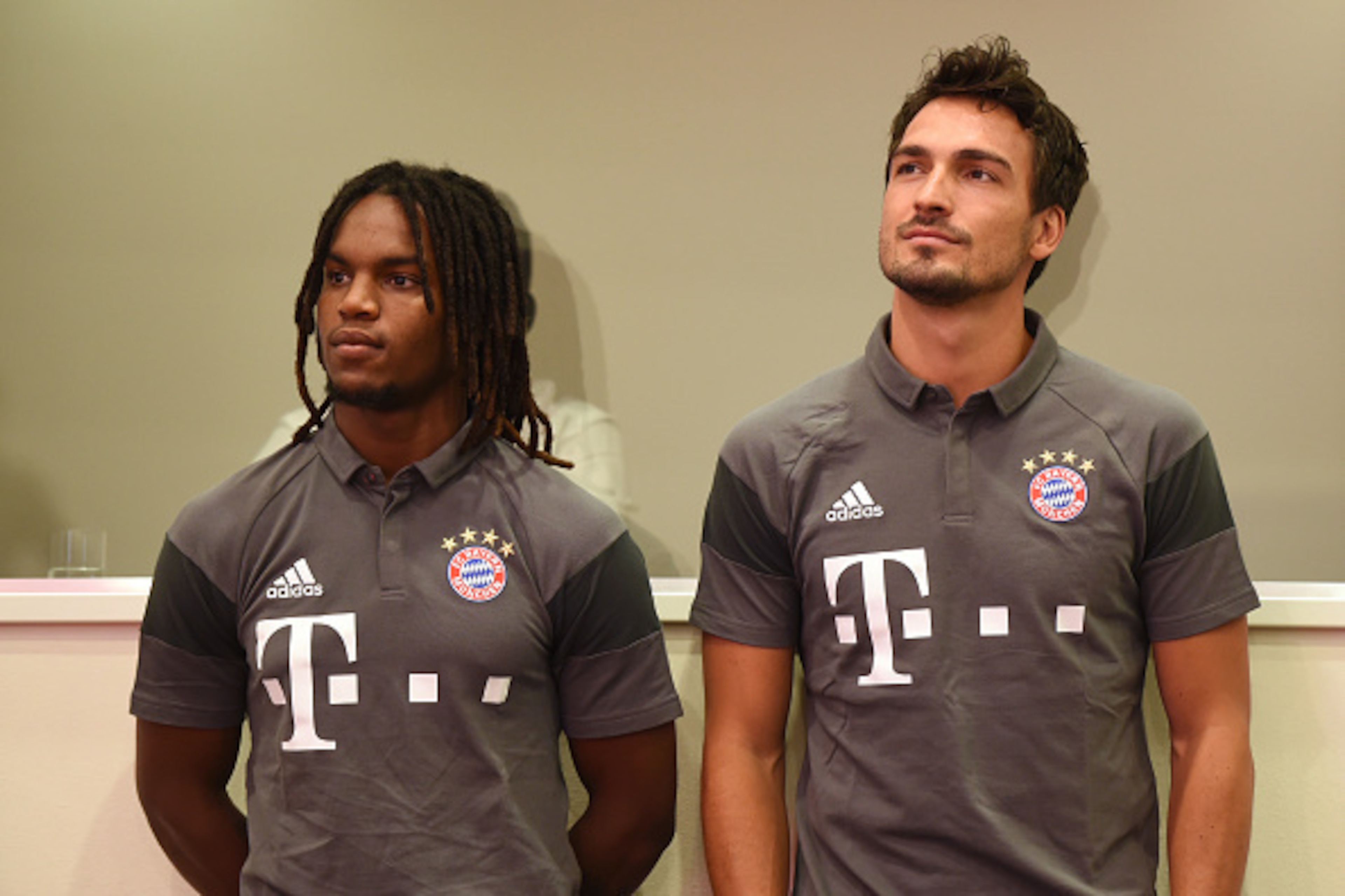 Bayern Munich's Portuguese midfielder Renato Sanches (L) and defender Mats Hummels (R) wait prior a press conference ahead season presentation of the German first division Bundesliga club FC Bayern Munich in the stadium in Munich, southern Germany, on Aug