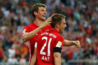 MUNICH, GERMANY - AUGUST 26:  Philipp Lahm (R) of Bayern Muenchen celebrates his team's fourth goal during the Bundesliga match between Bayern Muenchen and Werder Bremen at Allianz Arena on August 26, 2016 in Munich, Germany.  (Photo by Boris Streubel/Get
