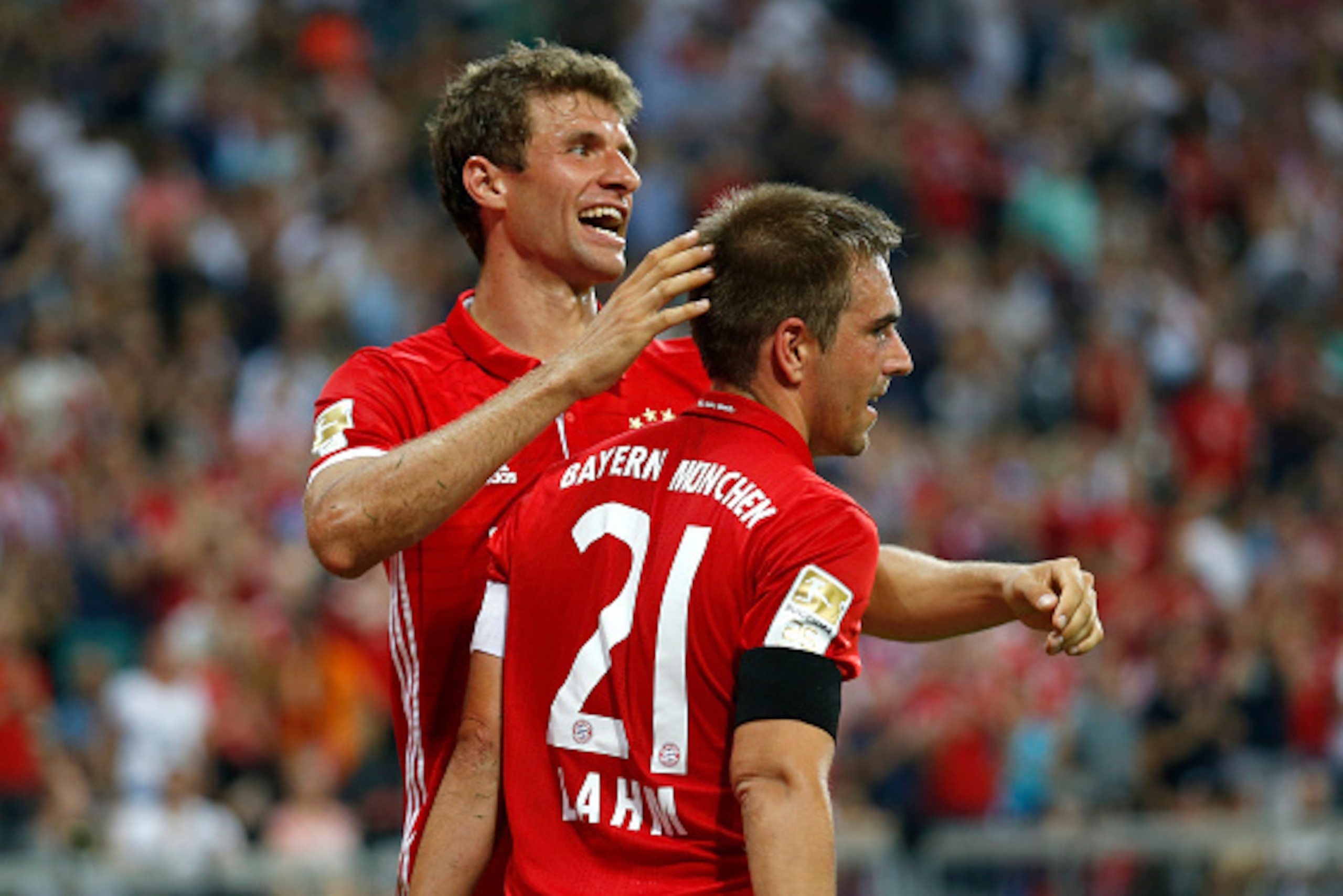 MUNICH, GERMANY - AUGUST 26:  Philipp Lahm (R) of Bayern Muenchen celebrates his team's fourth goal during the Bundesliga match between Bayern Muenchen and Werder Bremen at Allianz Arena on August 26, 2016 in Munich, Germany.  (Photo by Boris Streubel/Get