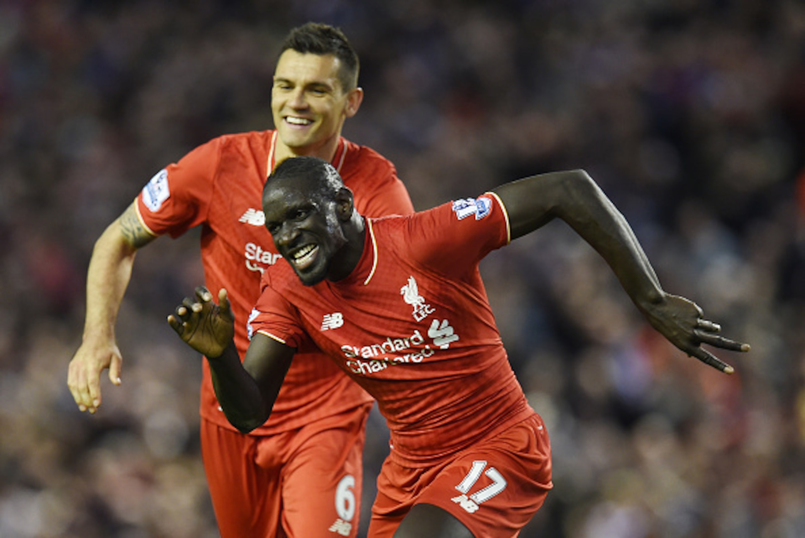 Liverpool's French defender Mamadou Sakho (R) celebrates with Liverpool's Croatian defender Dejan Lovren after scoring during the English Premier League football match between Liverpool and Everton at Anfield in Liverpool, north west England on April 20, 