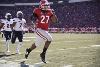 Nov 22, 2014; Athens, GA, USA; Georgia Bulldogs running back Nick Chubb (27) runs 83 yards for a touchdown against the Charleston Southern Buccaneers during the first quarter at Sanford Stadium. Mandatory Credit: Dale Zanine-USA TODAY Sports