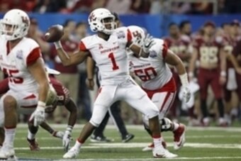 Dec 31, 2015; Atlanta, GA, USA; Houston Cougars quarterback Greg Ward Jr. (1) throws the ball against the Florida State Seminoles in the fourth quarter in the 2015 Chick-fil-A Peach Bowl at the Georgia Dome. The Cougars won 38-24. Mandatory Credit: Brett 
