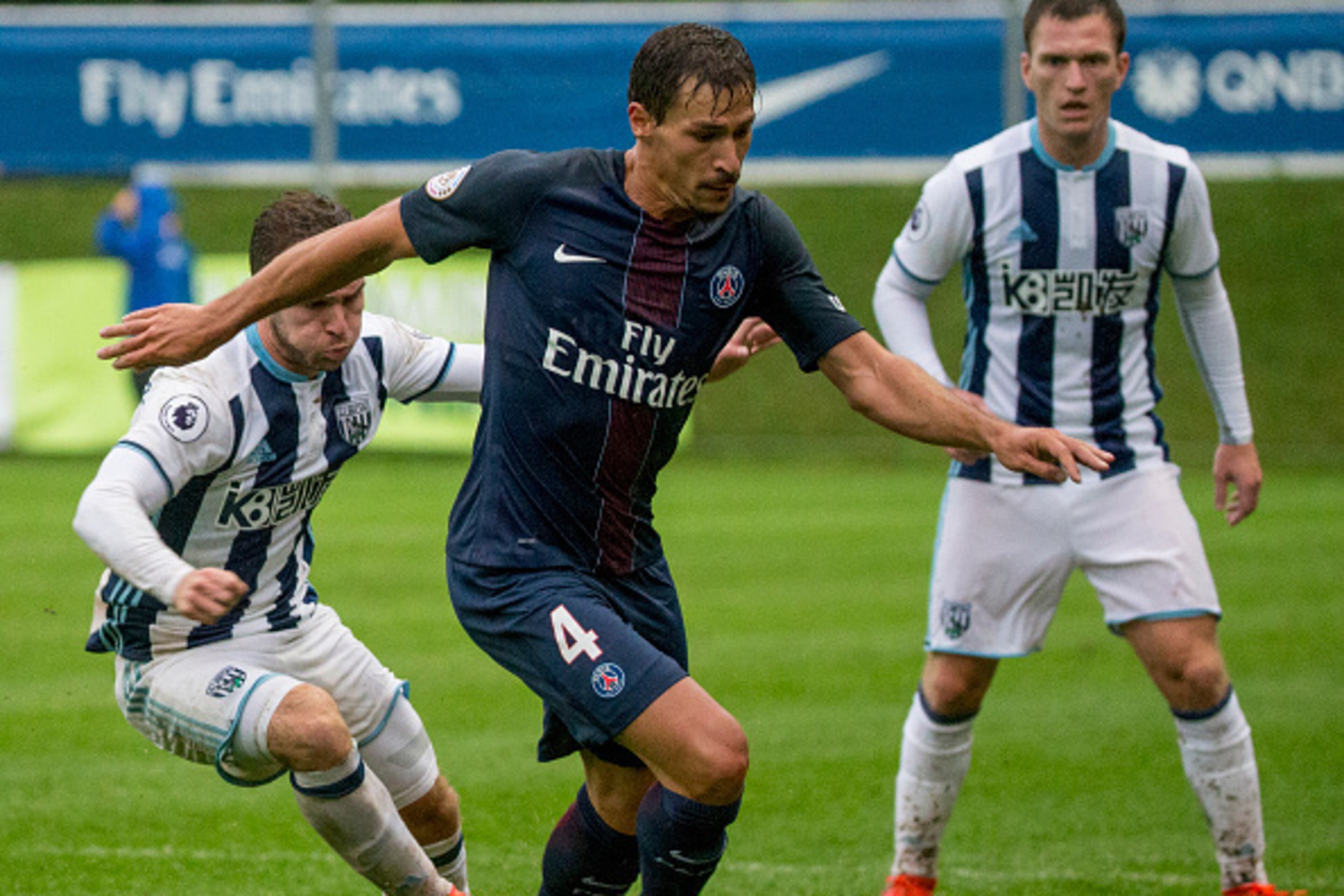 SCHLADMING, AUSTRIA - JULY 13: Callum McManaman (L) of West Bromwich Albion is challenged by JBenjamin Stambouli (R) of Paris St. Germain during a friendly match on July 13, 2016 in Schladming, Austria. (Photo by Marc Mueller/Getty Images)