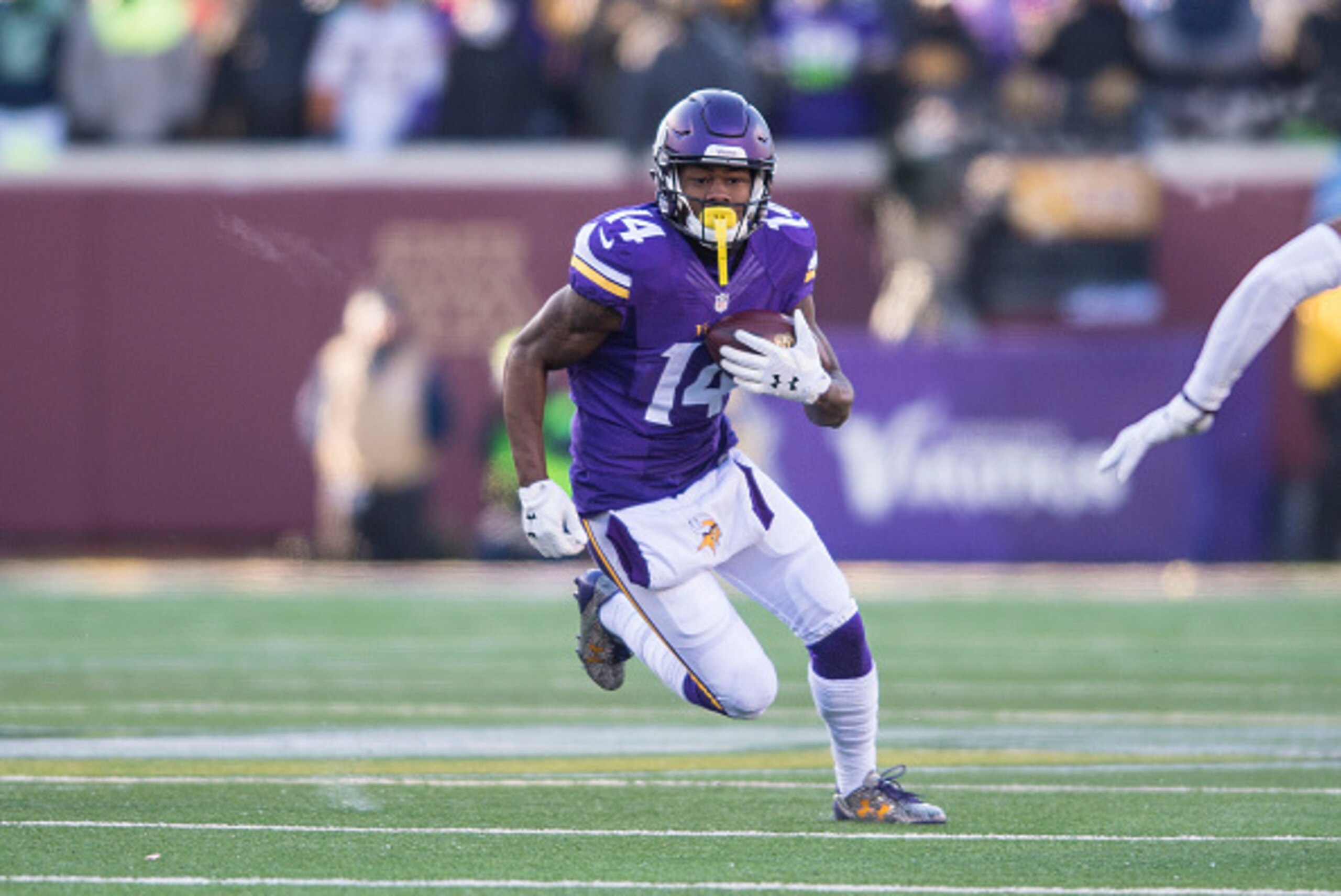 MINNEAPOLIS, MN - JANUARY 10: Stefon Diggs #14 of the Minnesota Vikings carries the ball during an NFL game against the Seattle Seahawks at TCF Bank Stadium January 10, 2016 in Minneapolis, Minnesota.  (Photo by Tom Dahlin/Getty Images)