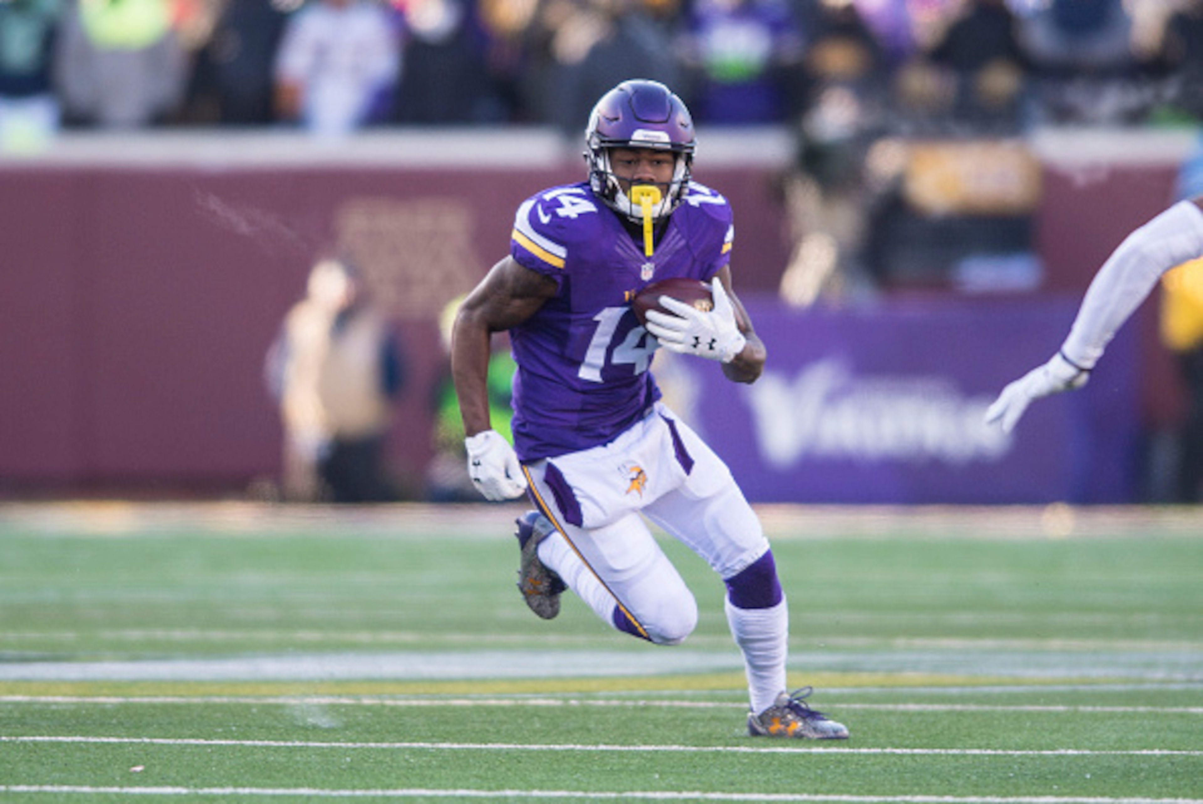 MINNEAPOLIS, MN - JANUARY 10: Stefon Diggs #14 of the Minnesota Vikings carries the ball during an NFL game against the Seattle Seahawks at TCF Bank Stadium January 10, 2016 in Minneapolis, Minnesota.  (Photo by Tom Dahlin/Getty Images)