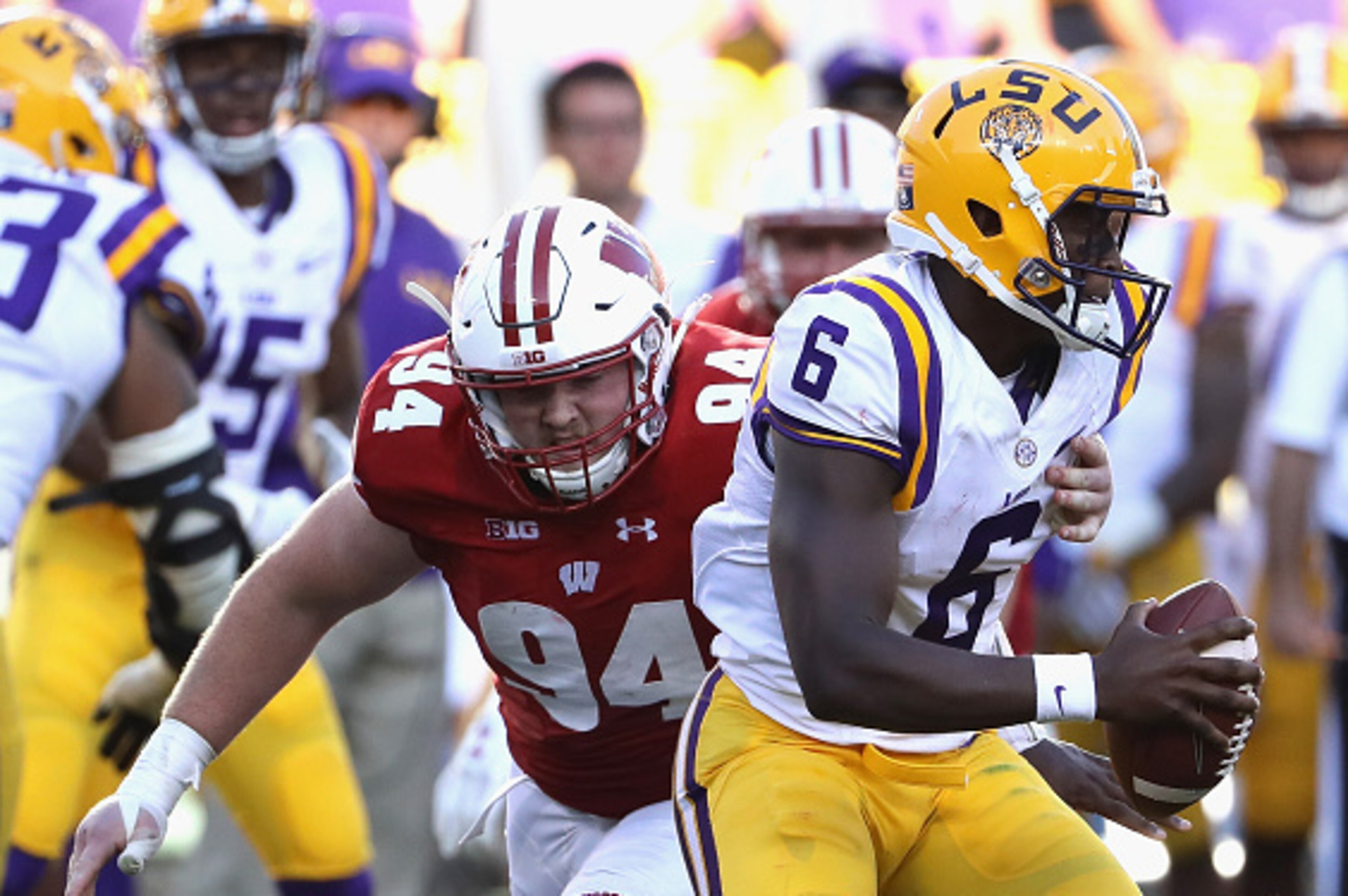 GREEN BAY, WI - SEPTEMBER 03:  Conor Sheehy #94 of the Wisconsin Badgers pressures Brandon Harris #6 of the LSU Tigers during the second half at Lambeau Field on September 3, 2016 in Green Bay, Wisconsin.  (Photo by Jonathan Daniel/Getty Images)