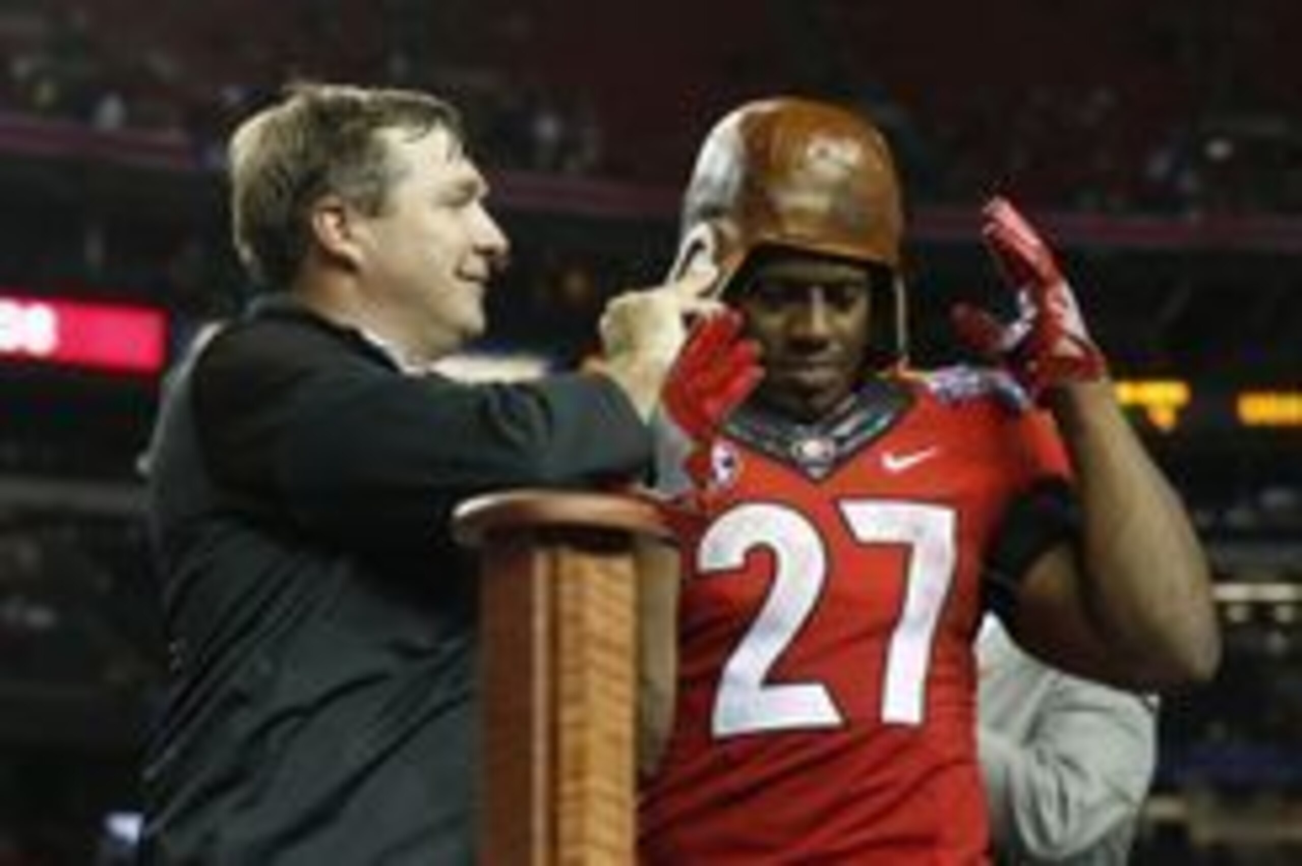 Sep 3, 2016; Atlanta, GA, USA;  Georgia Bulldogs head coach Kirby Smart puts the Old Leather Helmet on running back Nick Chubb (27) after the 2016 Chick-Fil-A Kickoff game against the North Carolina Tar Heels at Georgia Dome. Georgia won 33-24. Mandatory 