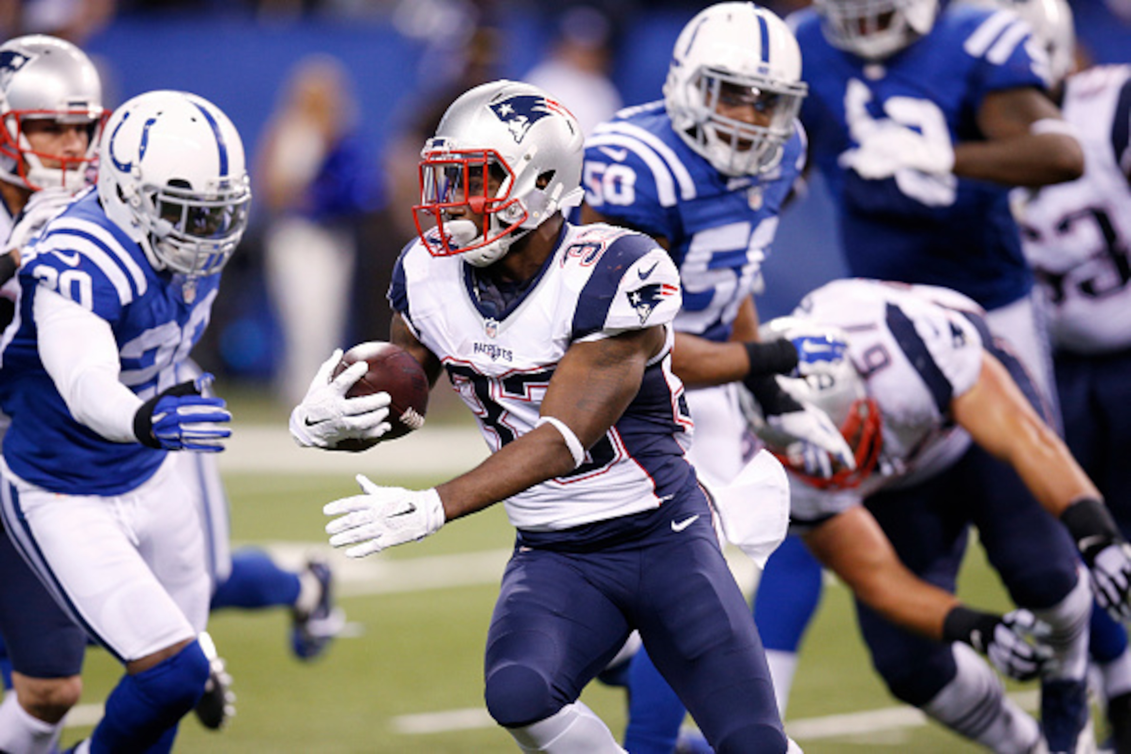 INDIANAPOLIS, IN - OCTOBER 18: Dion Lewis #33 of the New England Patriots runs with the ball during a game against the Indianapolis Colts at Lucas Oil Stadium on October 18, 2015 in Indianapolis, Indiana. The Patriots defeated the Colts 34-27. (Photo by J