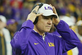 HOUSTON, TX - DECEMBER 29:  Head coach Les Miles of the LSU Tigers waits near the bench area before the start of their game against the Texas Tech Red Raiders during the AdvoCare V100 Texas Bowl at NRG Stadium on December 29, 2015 in Houston, Texas.  (Pho