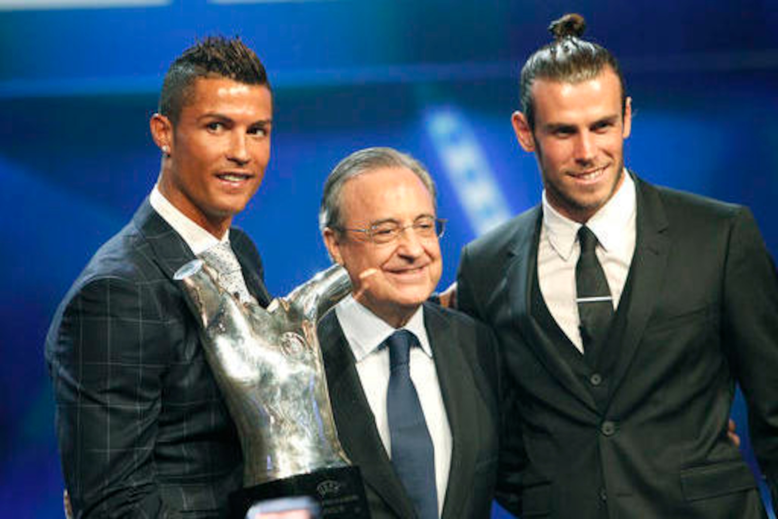 Bale (right) alongside team-mate Cristiano Ronaldo (left) and Real Madrid president Florentino Perez (middle).