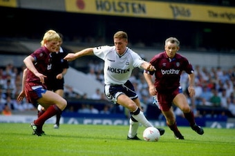 25 Aug 1990:  Paul Gascoigne of Tottenham Hotspur darts between Colin Hendry and Peter Reid of Manchester City during the League Division One match played at White Hart Lane in London, England.  \ Mandatory Credit: Allsport UK /Allsport