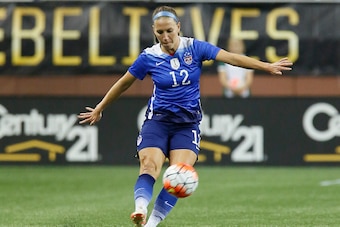DETROIT, MI - SEPTEMBER 17: Lauren Holiday #12 of the United States kicks the ball away against Haiti during the second half of the U.S. Women's 2015 World Cup victory tour match at Ford Field on September 17, 2015, in Detroit, Michigan. (Photo by Duane B