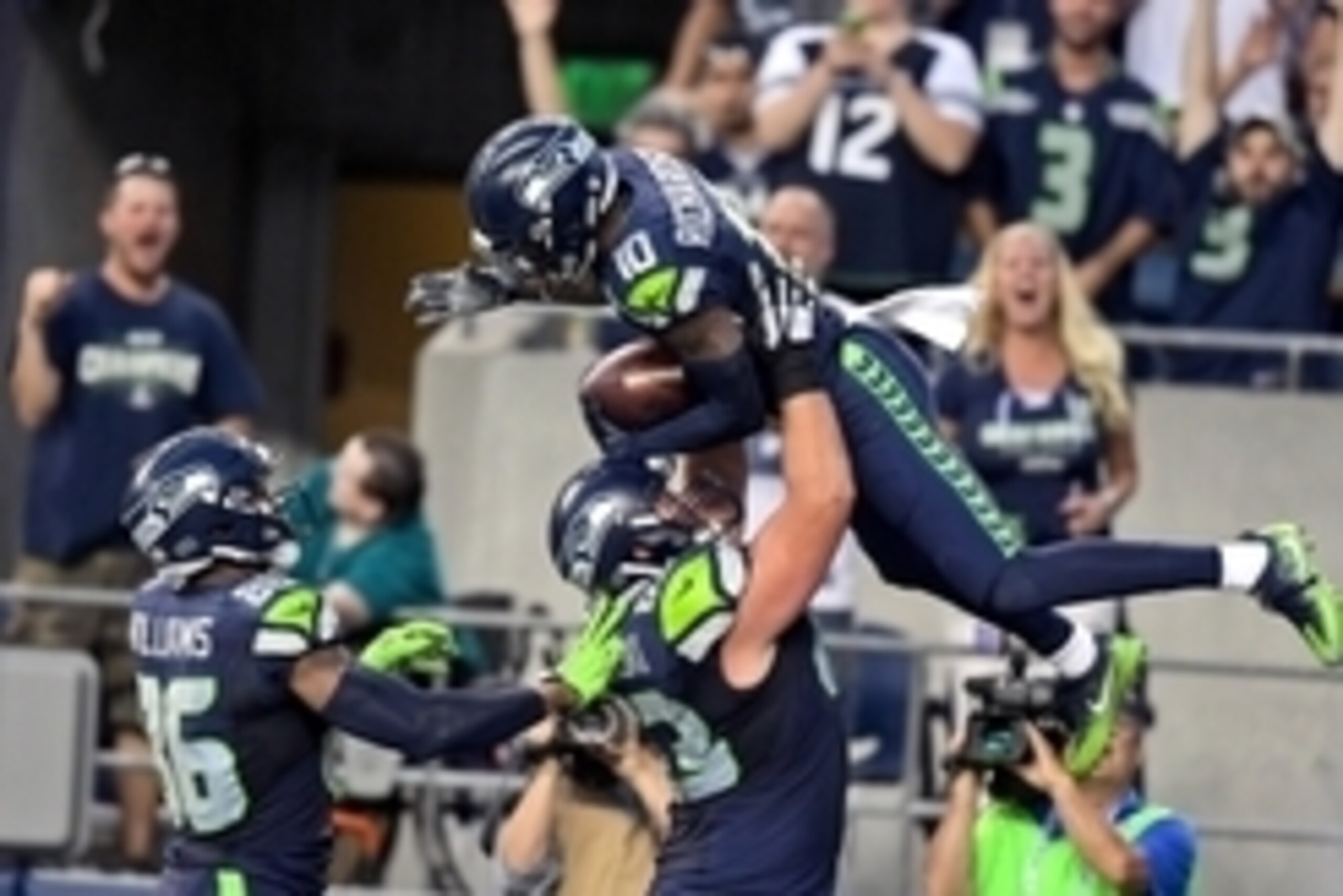 Aug 25, 2016; Seattle, WA, USA; Seattle Seahawks wide receiver Paul Richardson (10) is lifted into the air after scoring a touchdown against the Dallas Cowboys by teammate Seahawks offensive guard Mark Glowinski (63) during the first half of an NFL footba