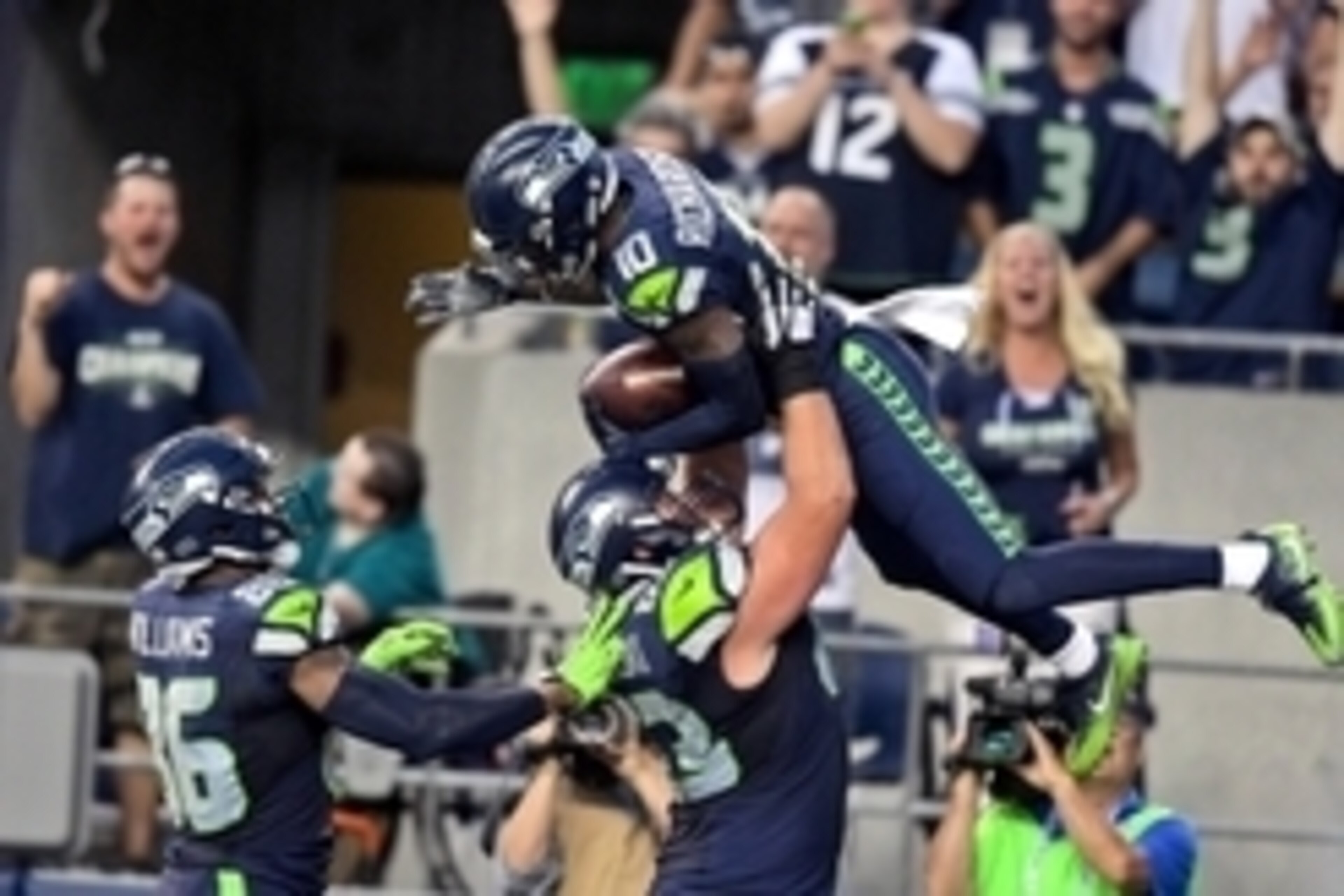 Aug 25, 2016; Seattle, WA, USA; Seattle Seahawks wide receiver Paul Richardson (10) is lifted into the air after scoring a touchdown against the Dallas Cowboys by teammate Seahawks offensive guard Mark Glowinski (63) during the first half of an NFL footba