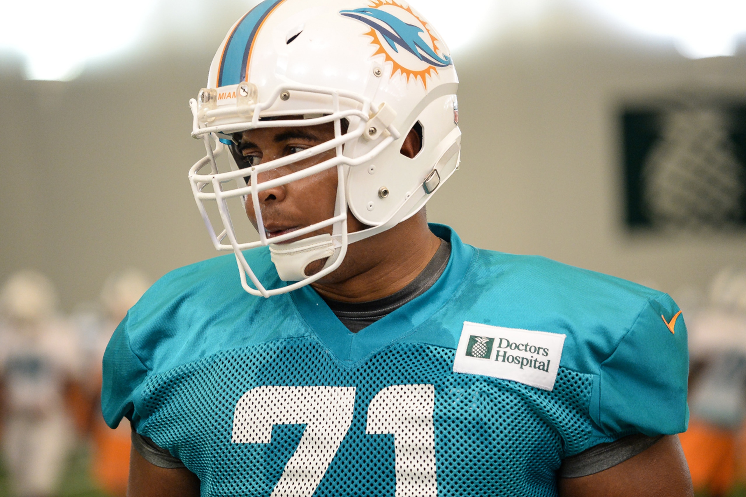 DAVIE, FL - JULY 27:  Jonathan Martin #71 of the Miami Dolphins looks on during practice at the Miami Dolphins training facility on July 27, 2013 in Davie, Florida.  (Photo by Ron Elkman/Sports Imagery/ Getty Images)