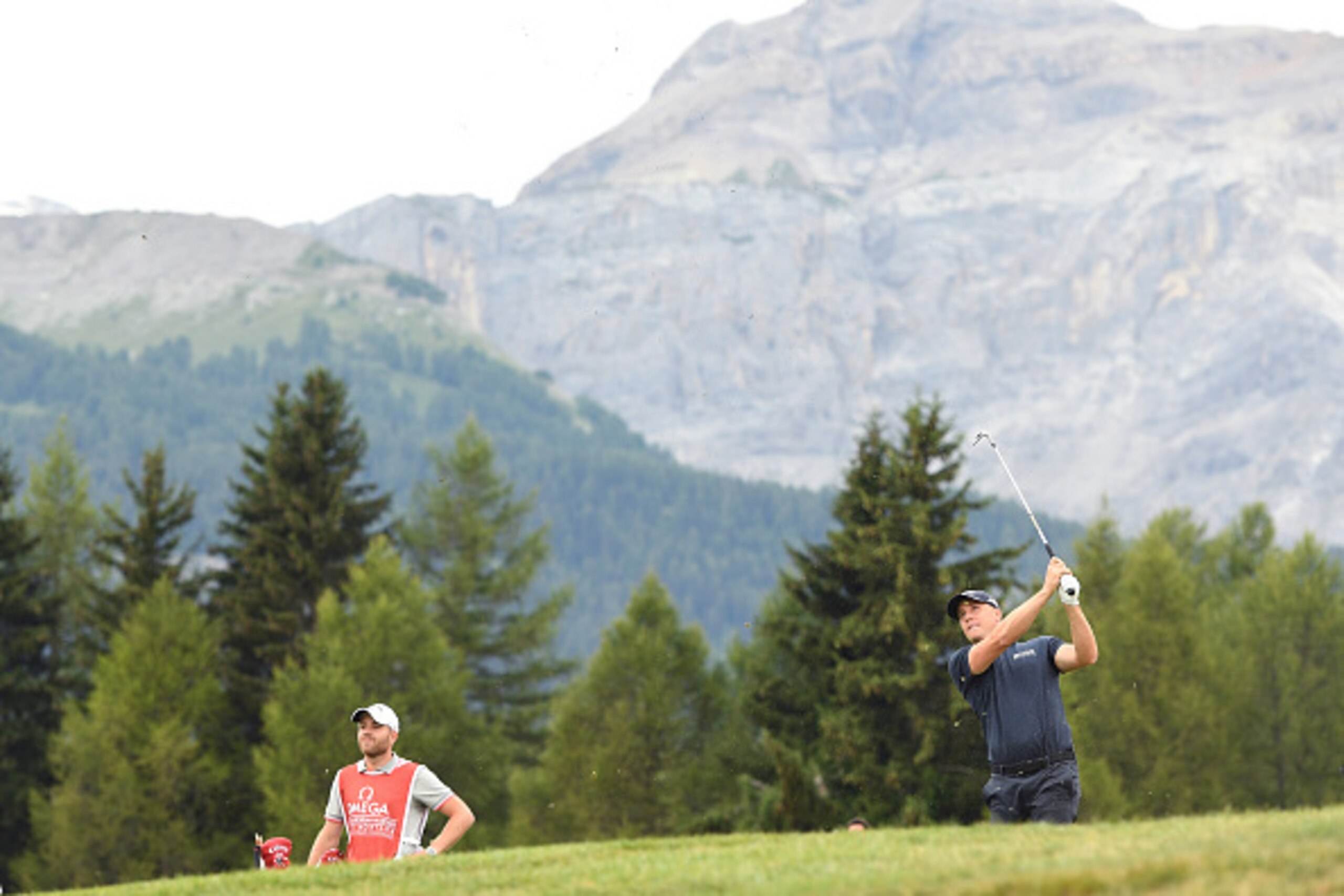 CRANS-MONTANA, SWITZERLAND - SEPTEMBER 04:  Alex Noren of Sweden plays his second shot on the 12th hole during the final round of the Omega European Masters at Crans-sur-Sierre Golf Club on September 4, 2016 in Crans-Montana, Switzerland.  (Photo by Ross 