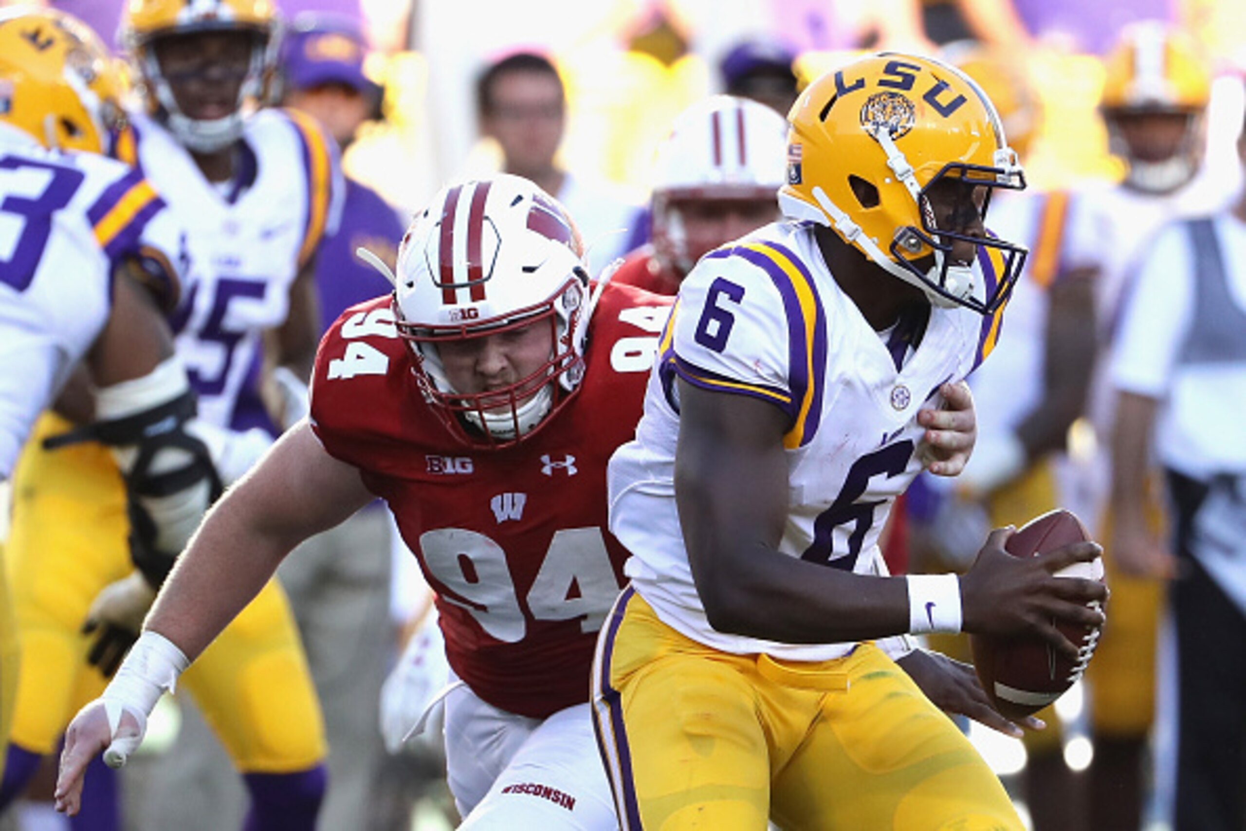 GREEN BAY, WI - SEPTEMBER 03:  Conor Sheehy #94 of the Wisconsin Badgers pressures Brandon Harris #6 of the LSU Tigers during the second half at Lambeau Field on September 3, 2016 in Green Bay, Wisconsin.  (Photo by Jonathan Daniel/Getty Images)