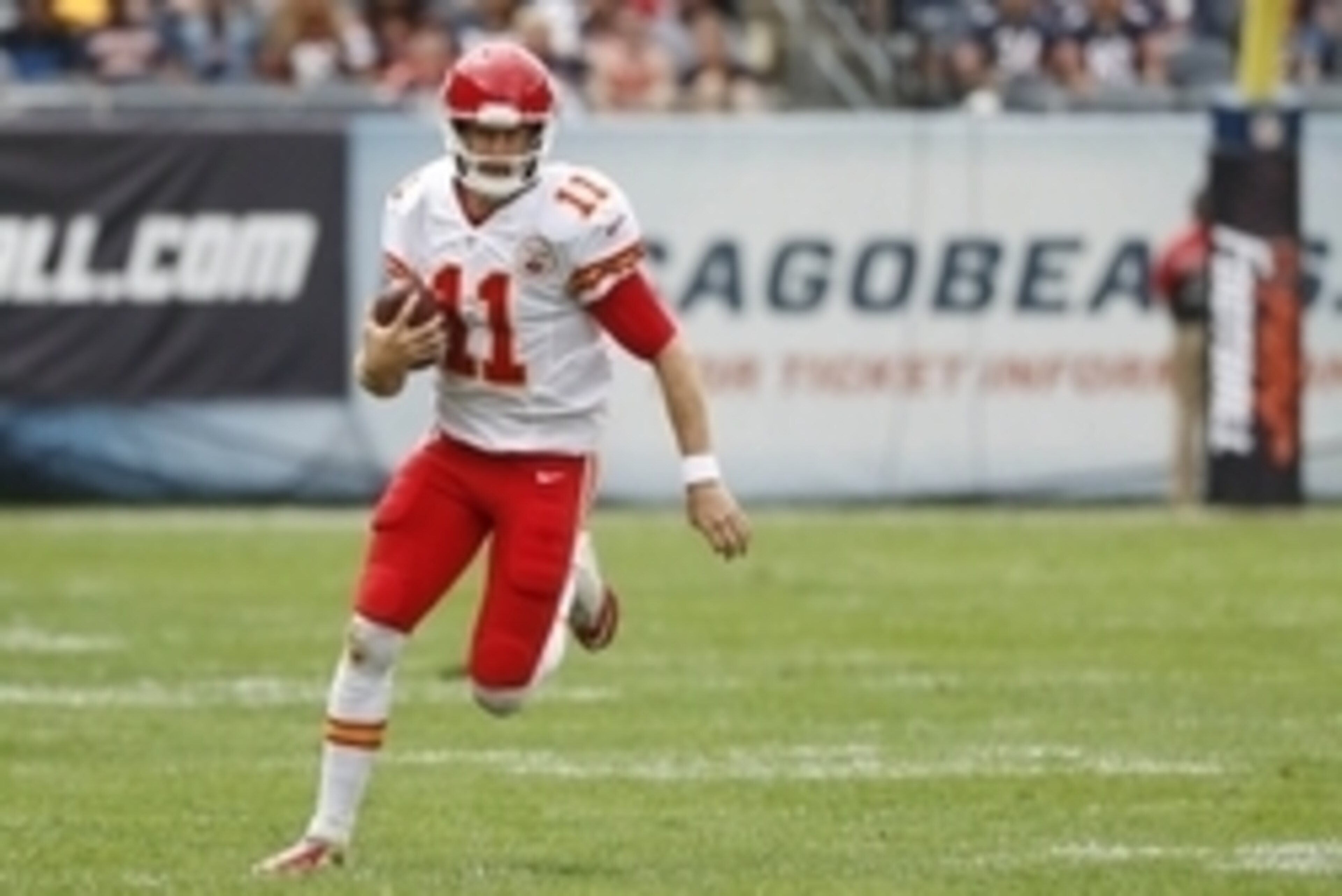 Aug 27, 2016; Chicago, IL, USA; Kansas City Chiefs quarterback Alex Smith (11) runs with the ball against the Chicago Bears during the first half of the preseason game at Soldier Field. Mandatory Credit: Kamil Krzaczynski-USA TODAY Sports