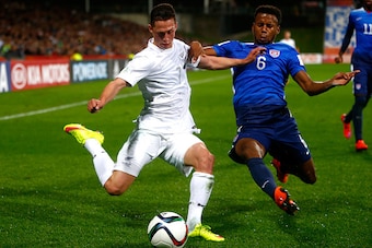 AUCKLAND, NEW ZEALAND - JUNE 02: Joel Stevens of New Zealand is tackled by Kellyn Parry-Acosta of the USA during the FIFA U-20 World Cup New Zealand 2015 Group A match between New Zealand and the United States at North Harbour Stadium on June 2, 2015 in A