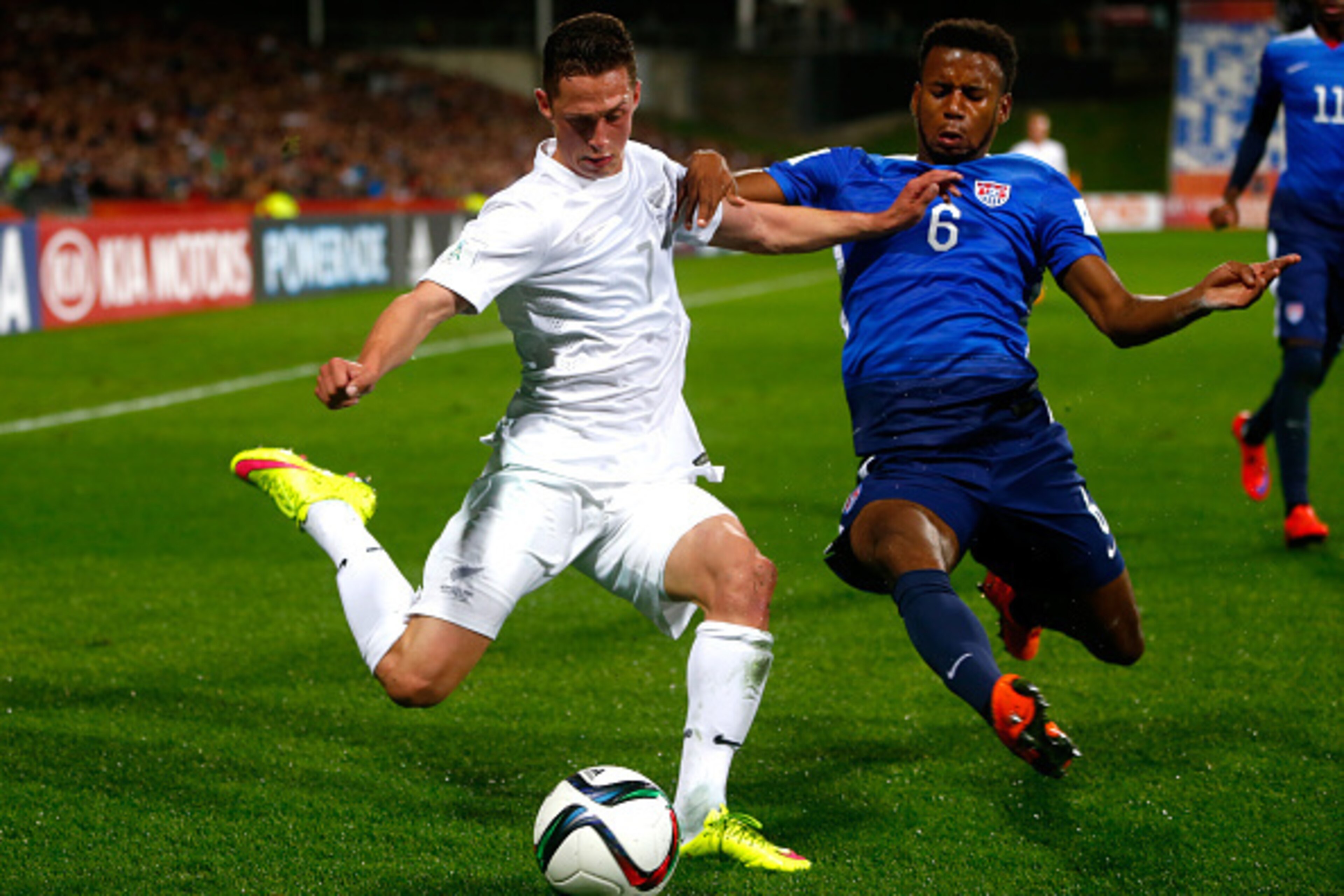AUCKLAND, NEW ZEALAND - JUNE 02: Joel Stevens of New Zealand is tackled by Kellyn Parry-Acosta of the USA during the FIFA U-20 World Cup New Zealand 2015 Group A match between New Zealand and the United States at North Harbour Stadium on June 2, 2015 in A